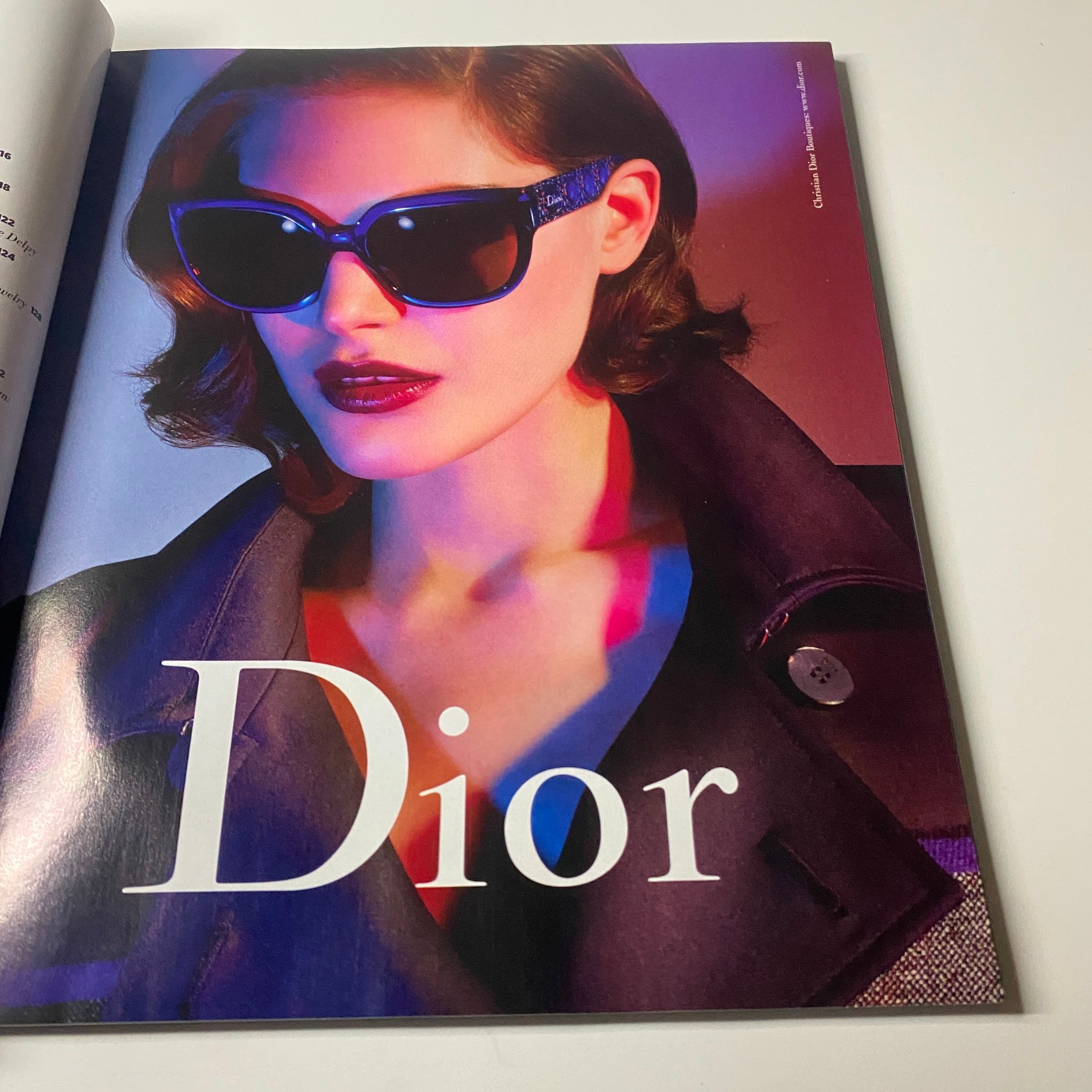 Dior advertisement featured in Harper's Bazaar Magazine June - July 2013 showcasing a model in stylish sunglasses, emphasizing luxury fashion.