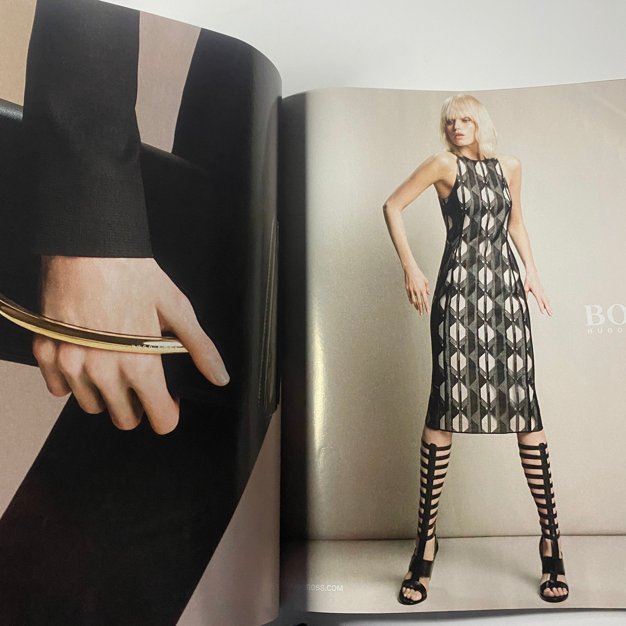 Harper's Bazaar Magazine March 2015 showcasing a bold BOSS advertisement, featuring a model in a geometric patterned dress with striking strappy heels.