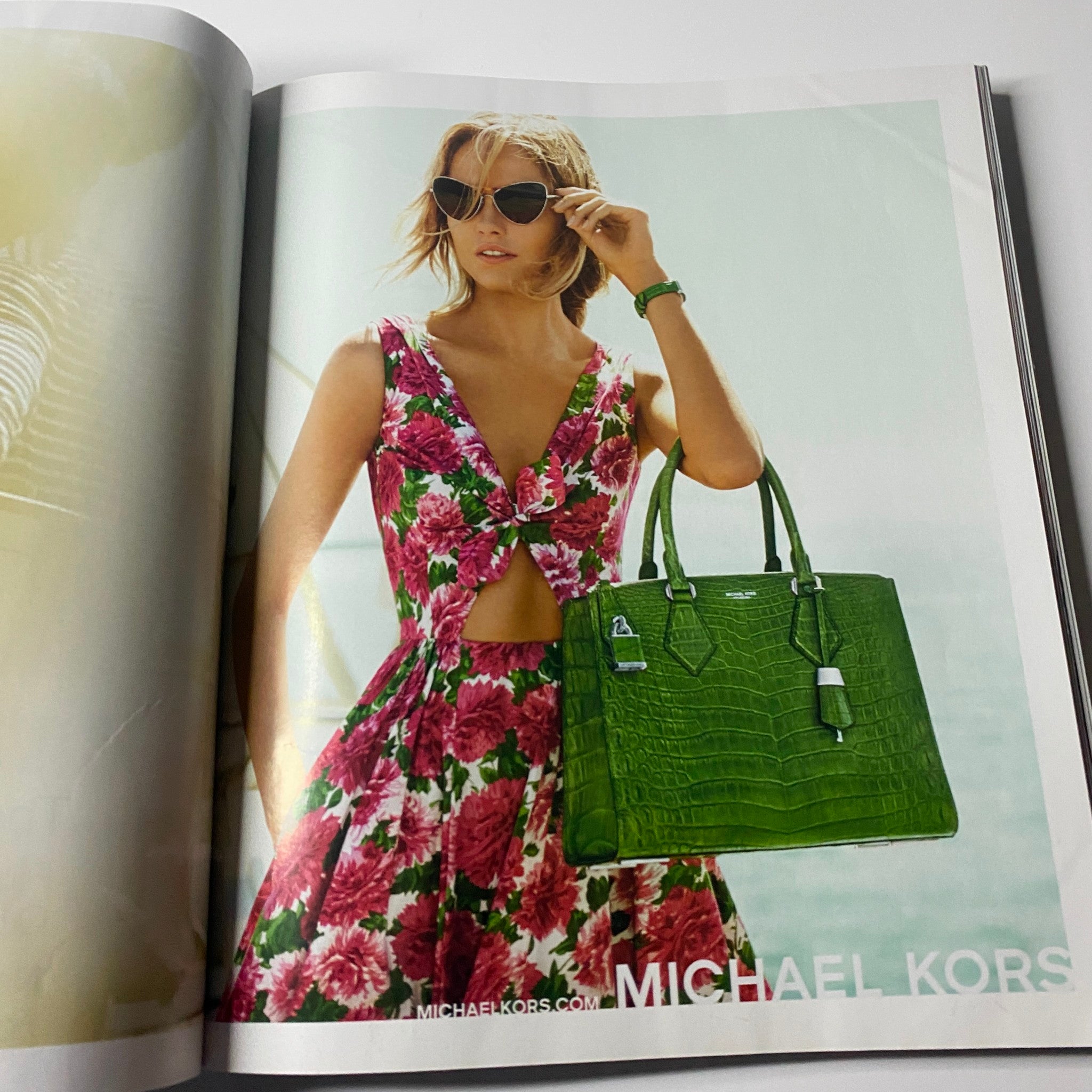 Harper's Bazaar Magazine March 2015 including a vibrant Michael Kors advertisement, showcasing a model in a floral dress holding a green handbag.