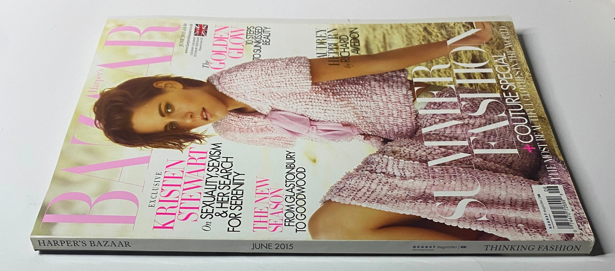 Harper's Bazaar UK Magazine June 2015 featuring Kristen Stewart on the cover in a stylish pink outfit, highlighting themes of identity and femininity.