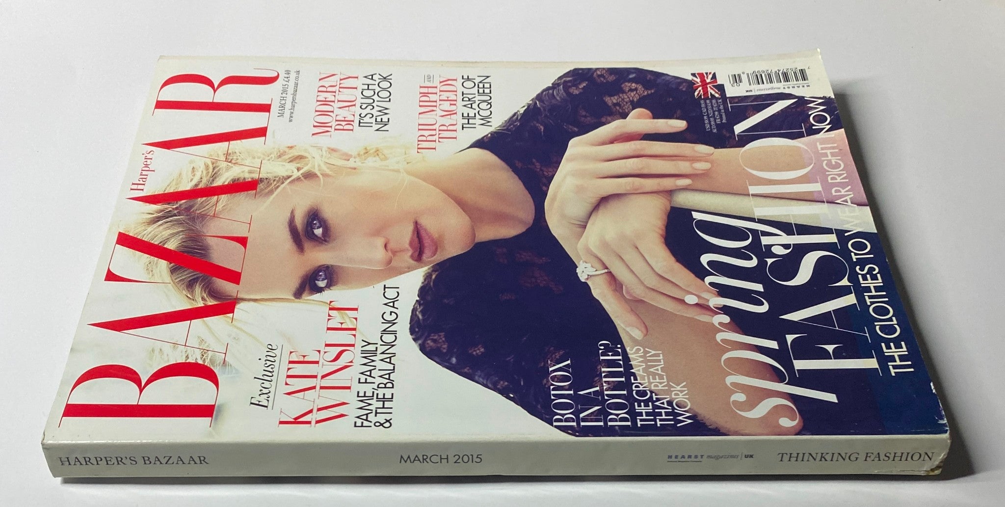 Side view of Harper's Bazaar UK Magazine March 2015 showcasing Kate Winslet on the cover. The cover emphasizes spring fashion with highlighted articles on beauty and the art of McQueen.