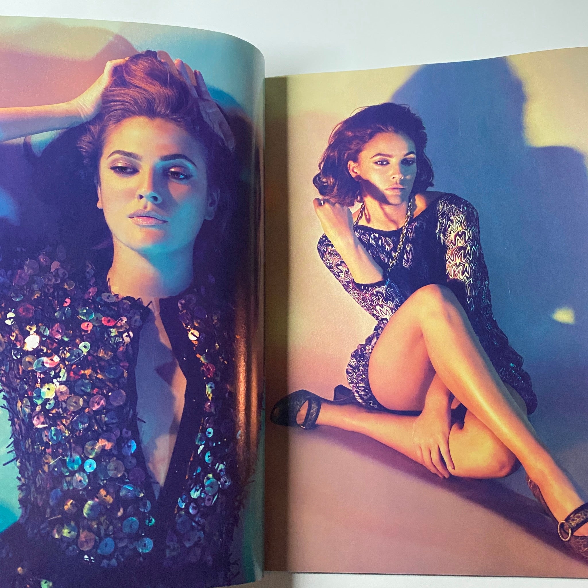 Harper's Bazaar Magazine February 2006, displaying a striking fashion editorial with a model styled in bold, glamorous poses, highlighting modern couture.