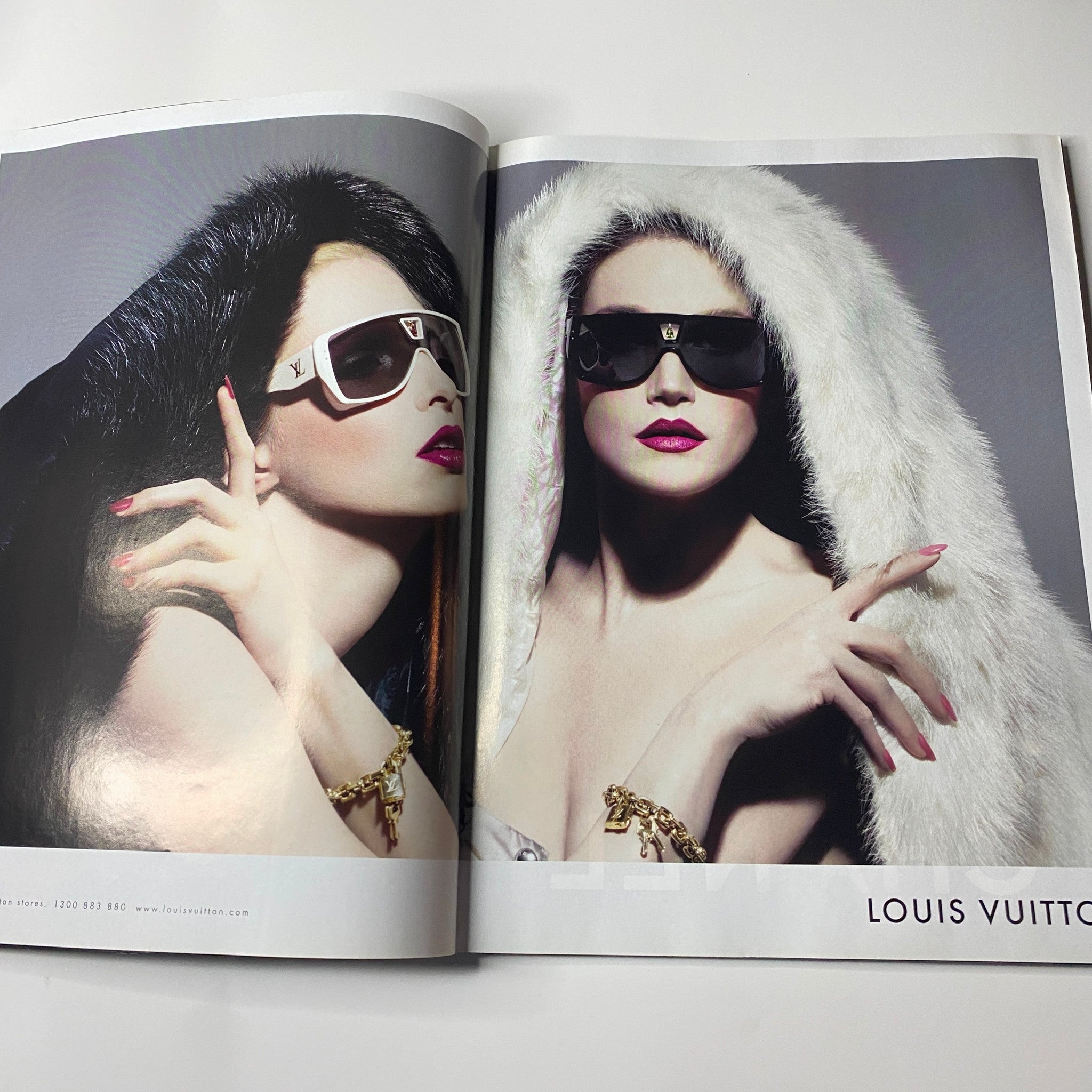 Louis Vuitton fashion spread with striking models wearing sunglasses and luxurious attire from Harper's Bazaar Australia Magazine October 2006.