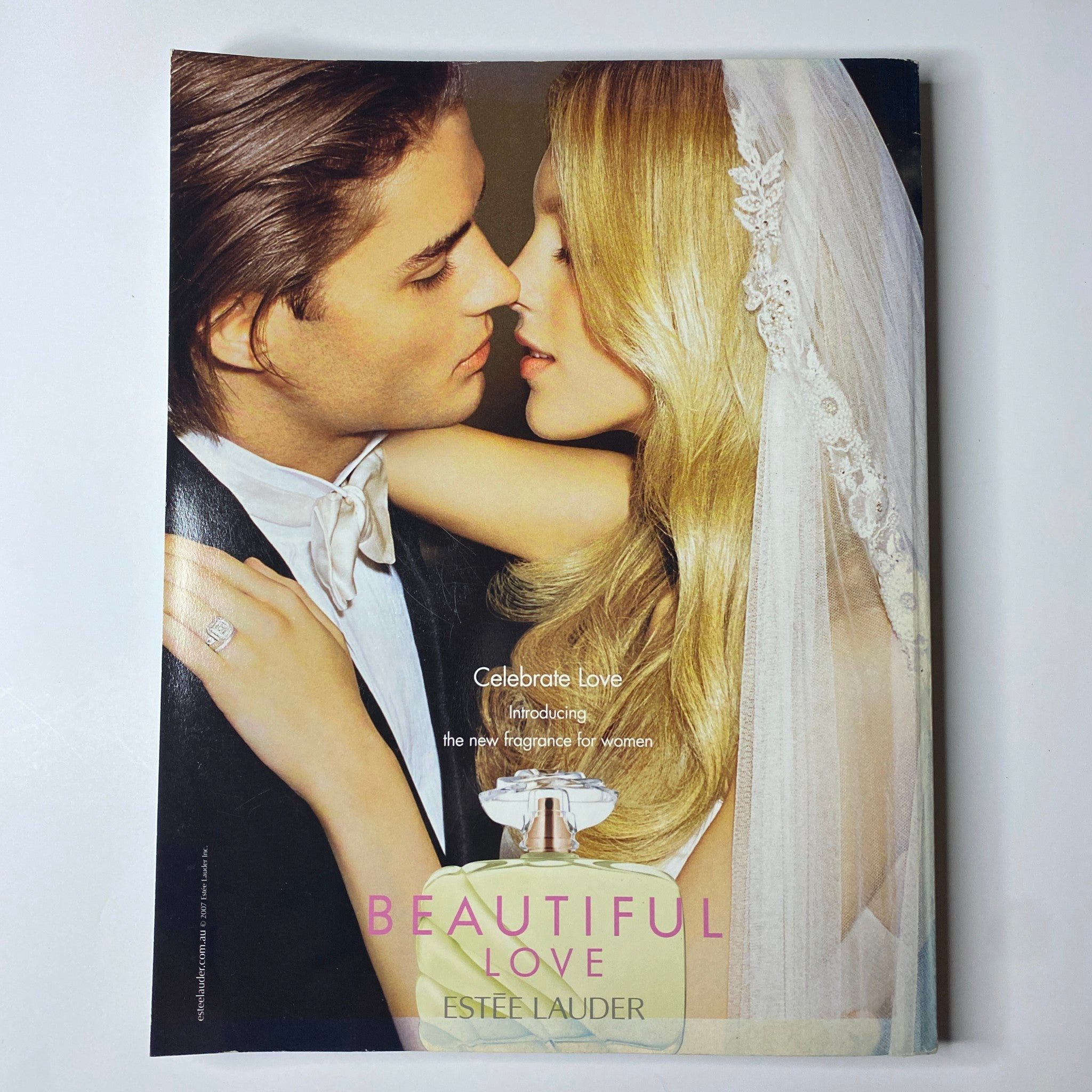 Harper's Bazaar Australia Magazine March 2007 introducing an Estée Lauder advertisement for Beautiful Love fragrance with a romantic couple.