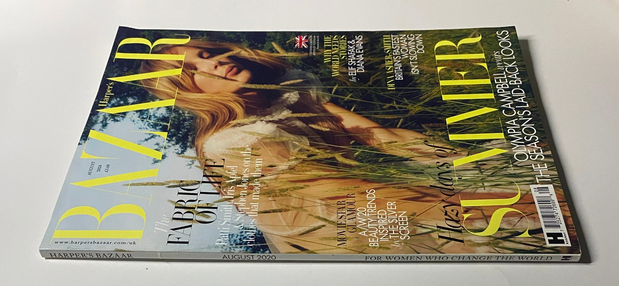 Close-up of the cover of Harper's Bazaar UK August 2020 with Olympia Campbell, showcasing the magazine's branding and seasonal theme.