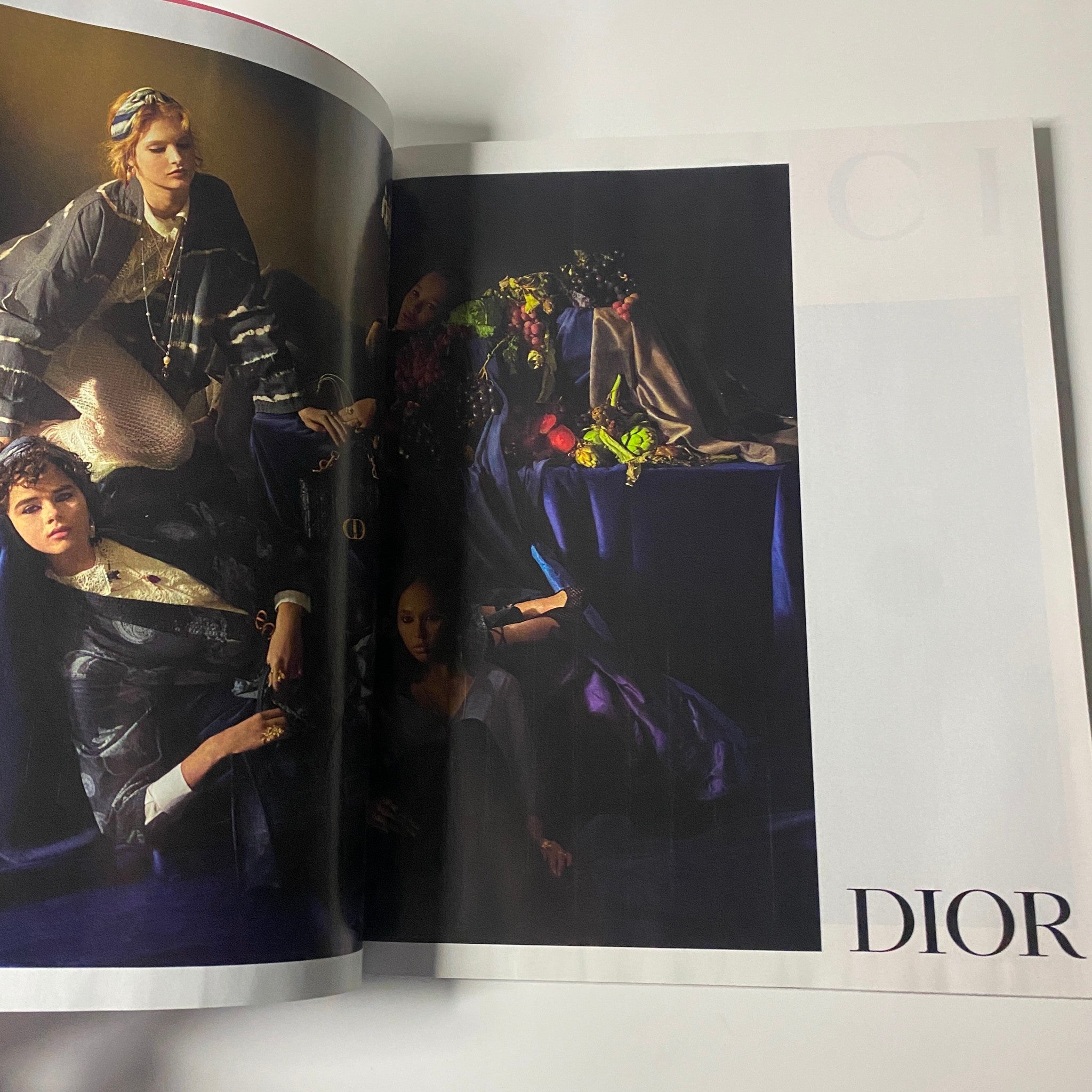 Dior fashion editorial from Harper's Bazaar Magazine February 2021 highlighting an elegant arrangement of models in sophisticated attire amidst a luxurious backdrop.
