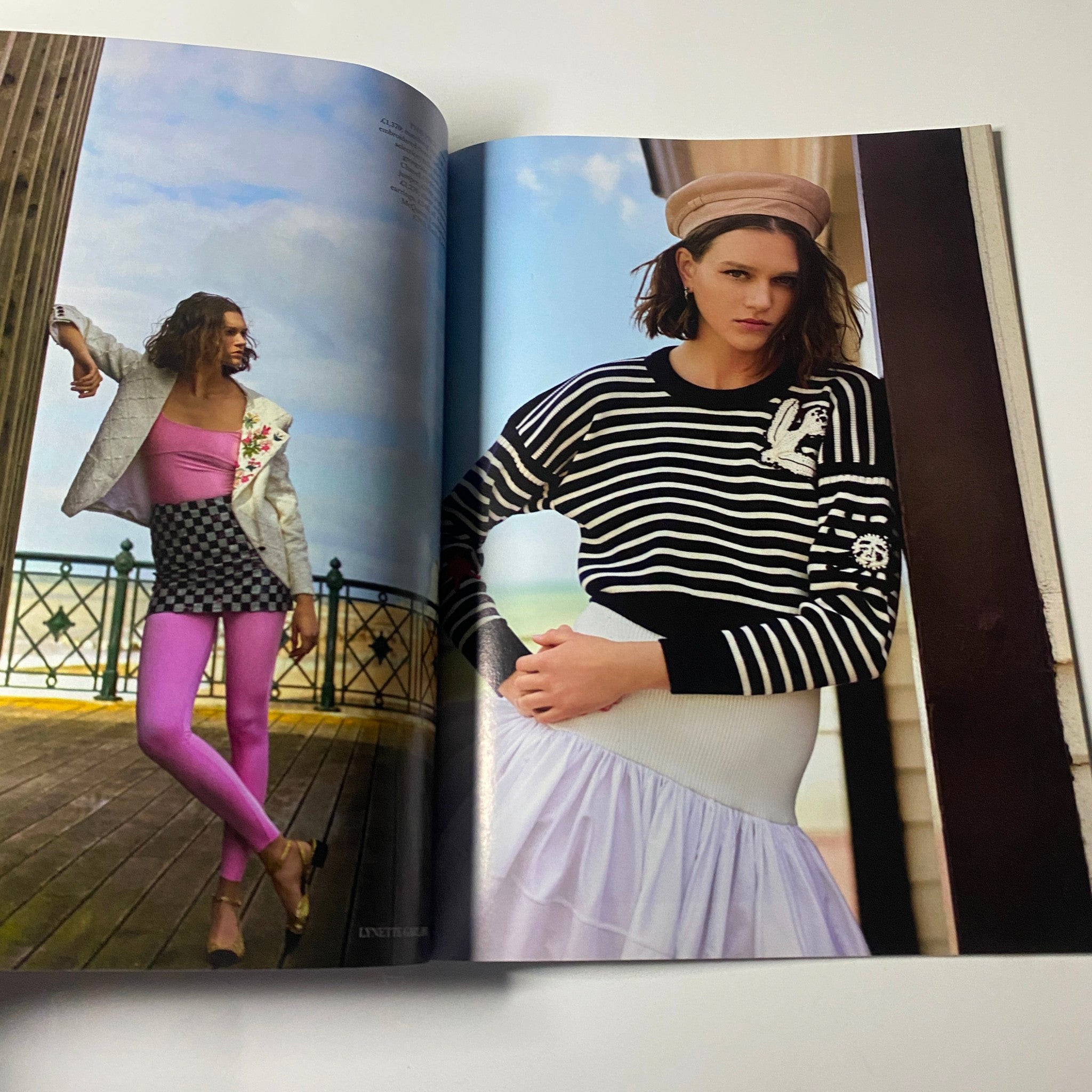 Harper's Bazaar UK Magazine August 2021 showcasing a bold fashion editorial with a model in striking athleisure wear, including a blazer and vibrant leggings, set against a scenic boardwalk backdrop.