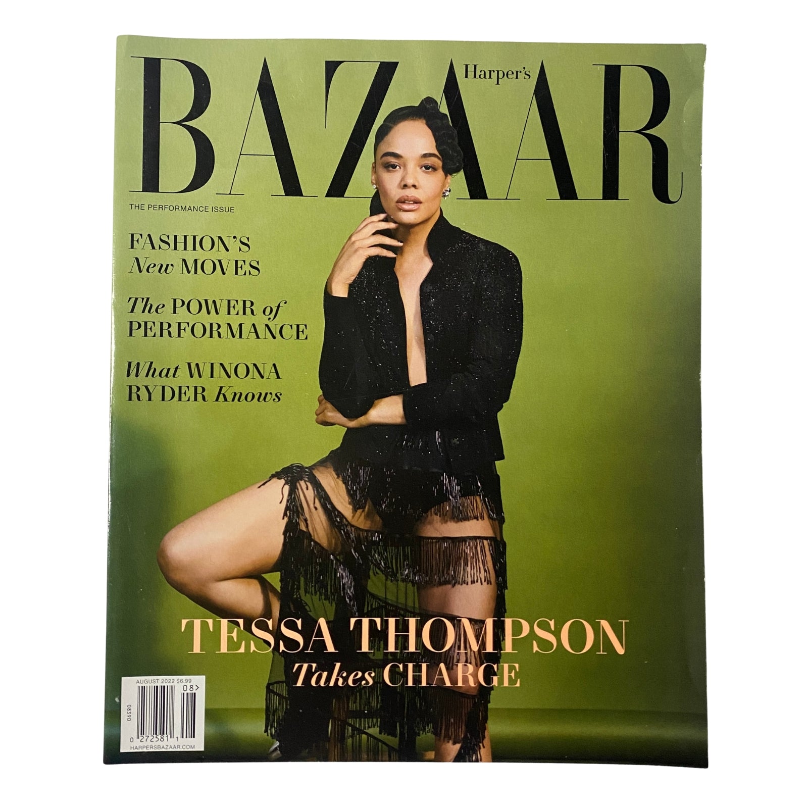 Cover of Harper's Bazaar Magazine August 2022 featuring Tessa Thompson. The cover showcases Thompson wearing a chic black outfit against a green background, emphasizing fashion and performance themes.