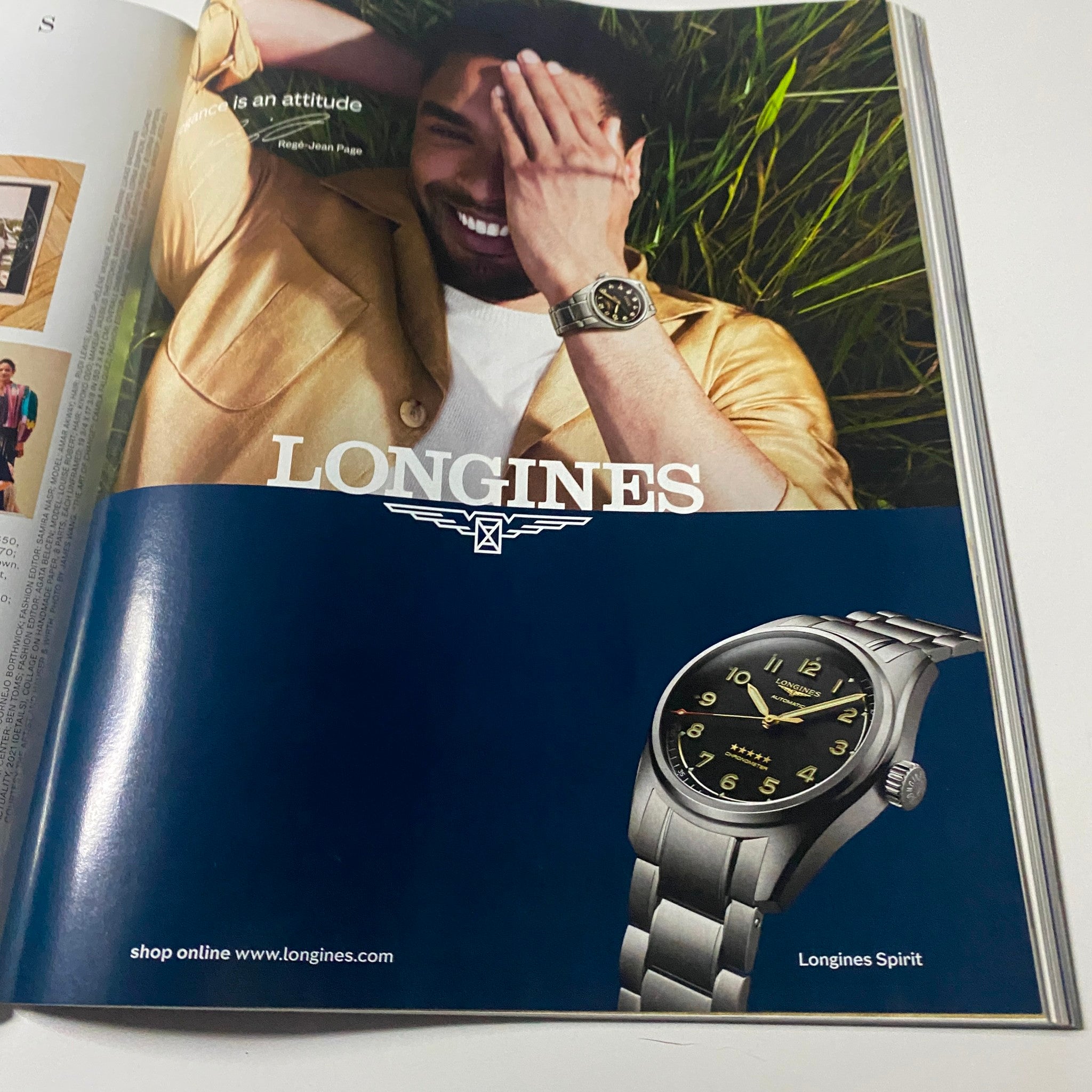 Advertisement page from Harper's Bazaar Magazine December 2021 promoting Longines watch, included in the issue featuring Hunter Schafer.