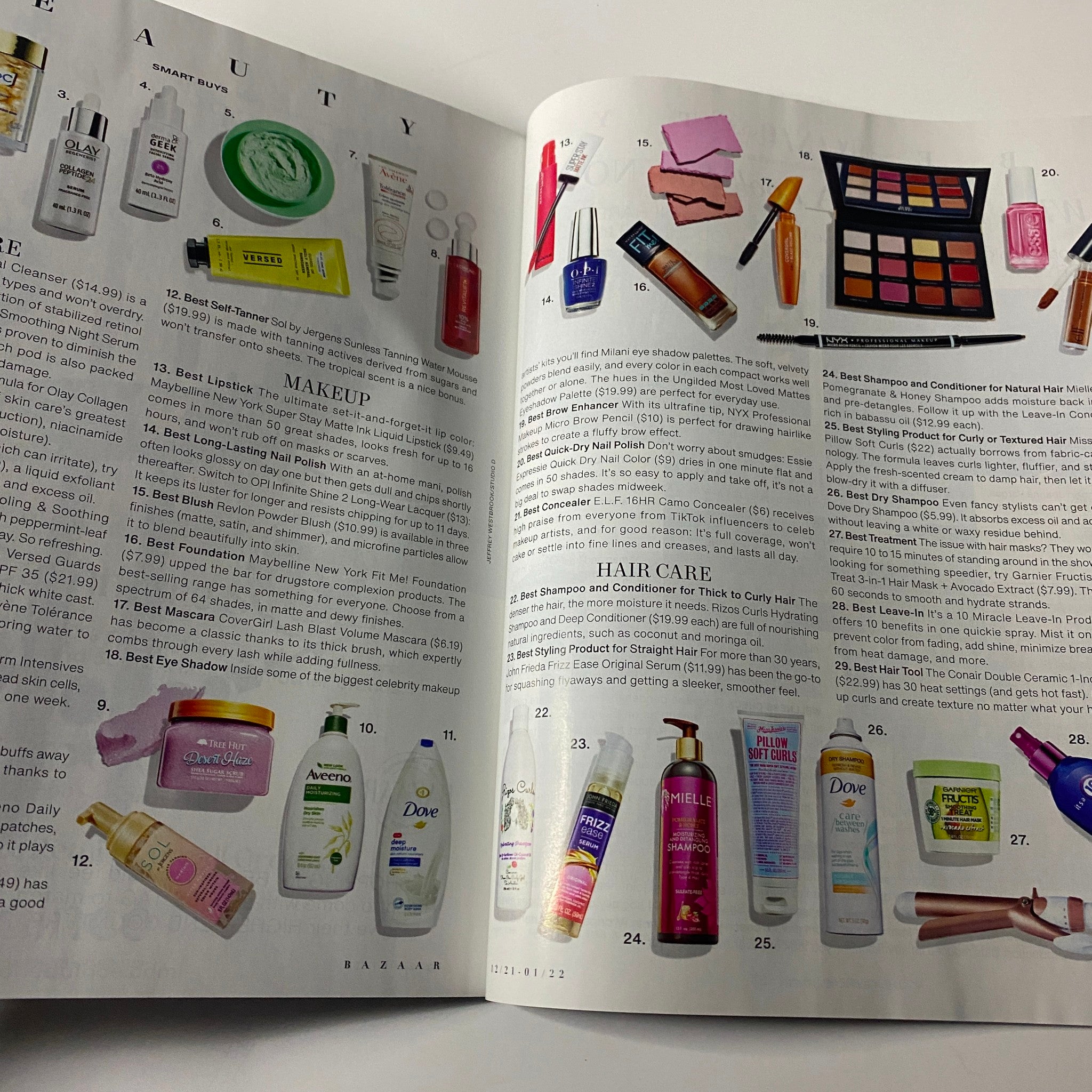 Inside spread of Harper's Bazaar Magazine December 2021 featuring beauty products, including skincare and makeup recommendations, showcasing the latest trends in hair care and cosmetics.