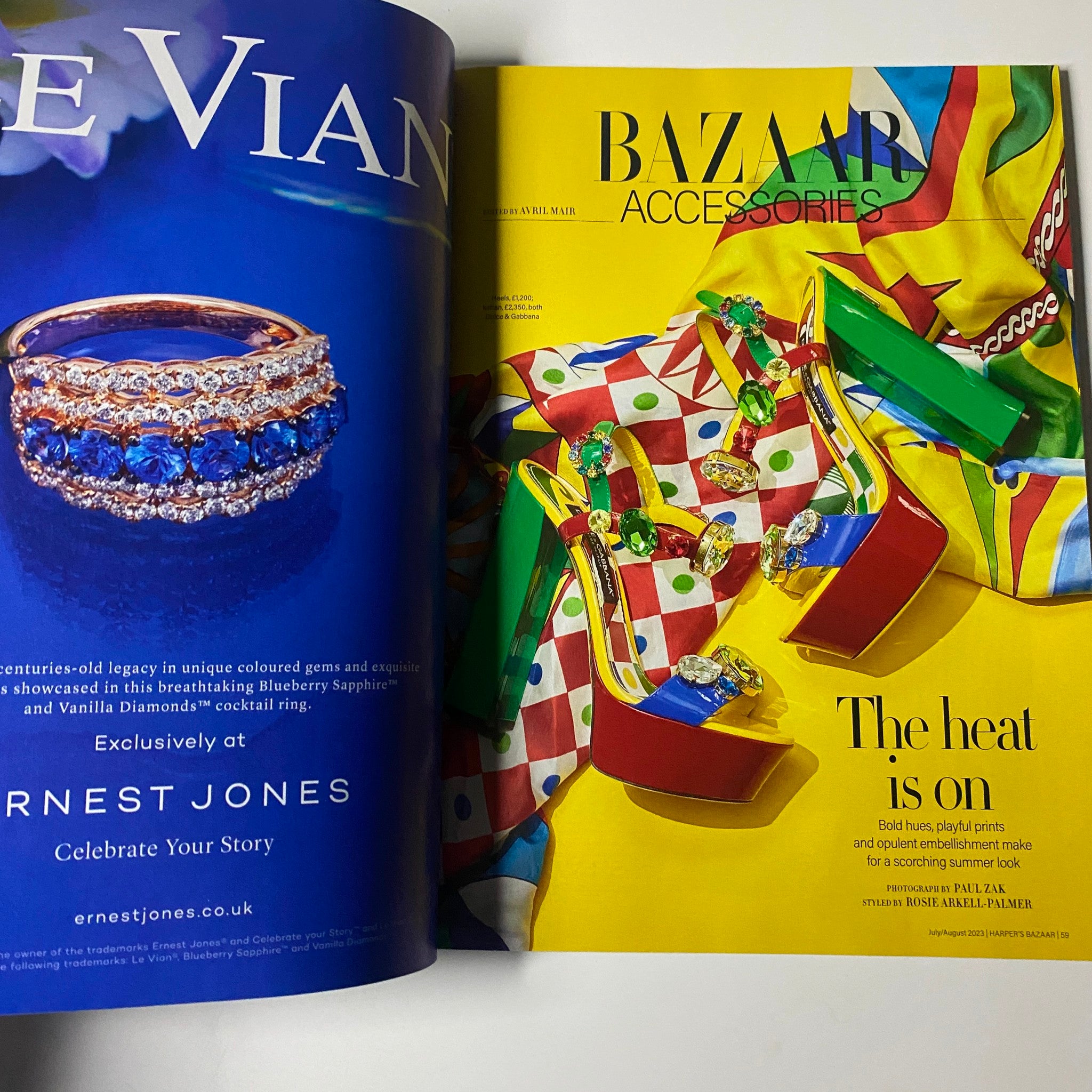 Harper's Bazaar UK Magazine July August 2023 showcasing an advertisement for vibrant accessories with the title 'The Heat is On,' featuring colorful footwear and jewelry.