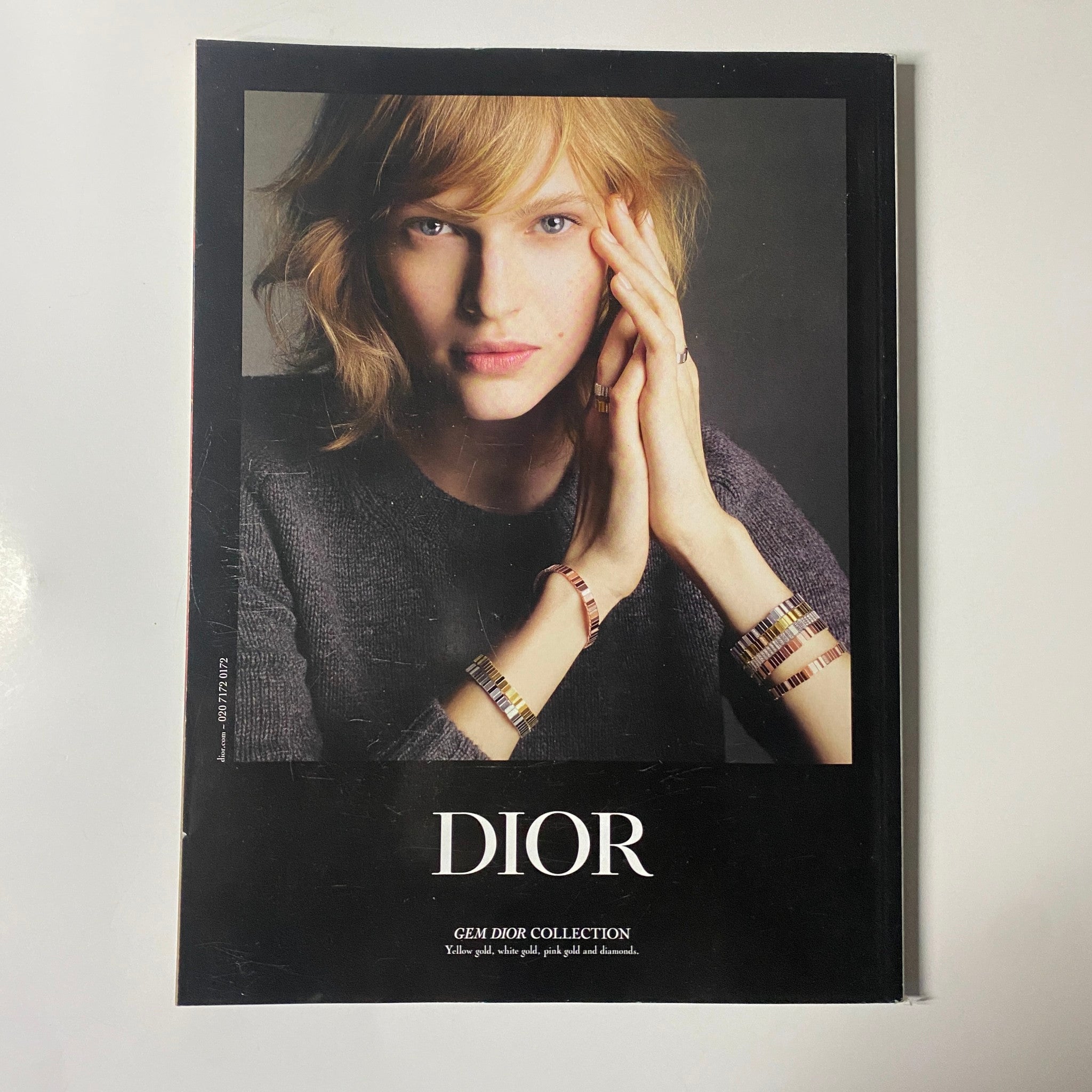 Harper's Bazaar UK Magazine July August 2023 back cover showcasing a Dior advertisement with a model wearing stylish jewelry from the Gem Dior Collection.