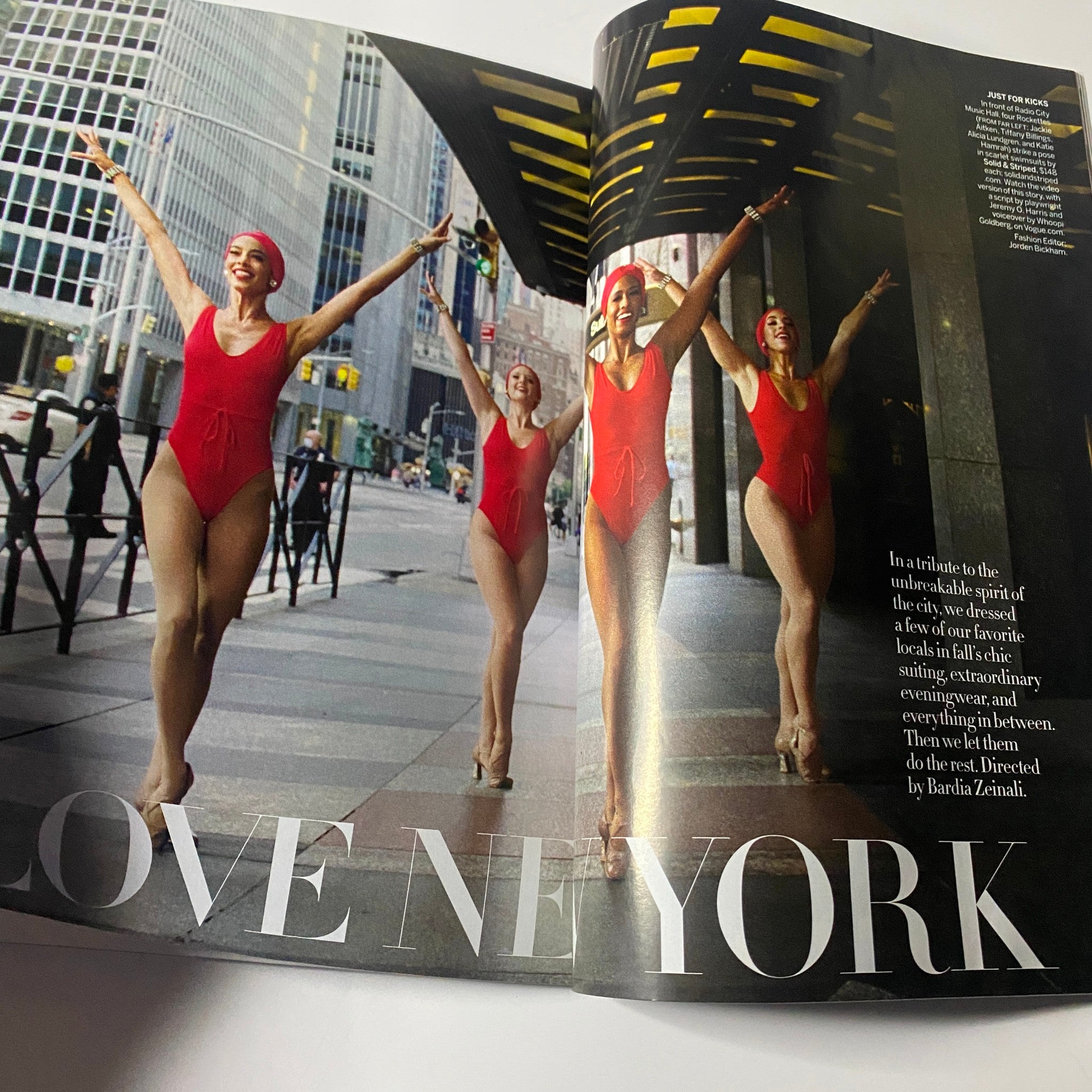 Vogue Magazine October 2020 features a vibrant dance scene titled 'Love New York,' highlighting performers in stylish red swimsuits, celebrating the spirit of the city.
