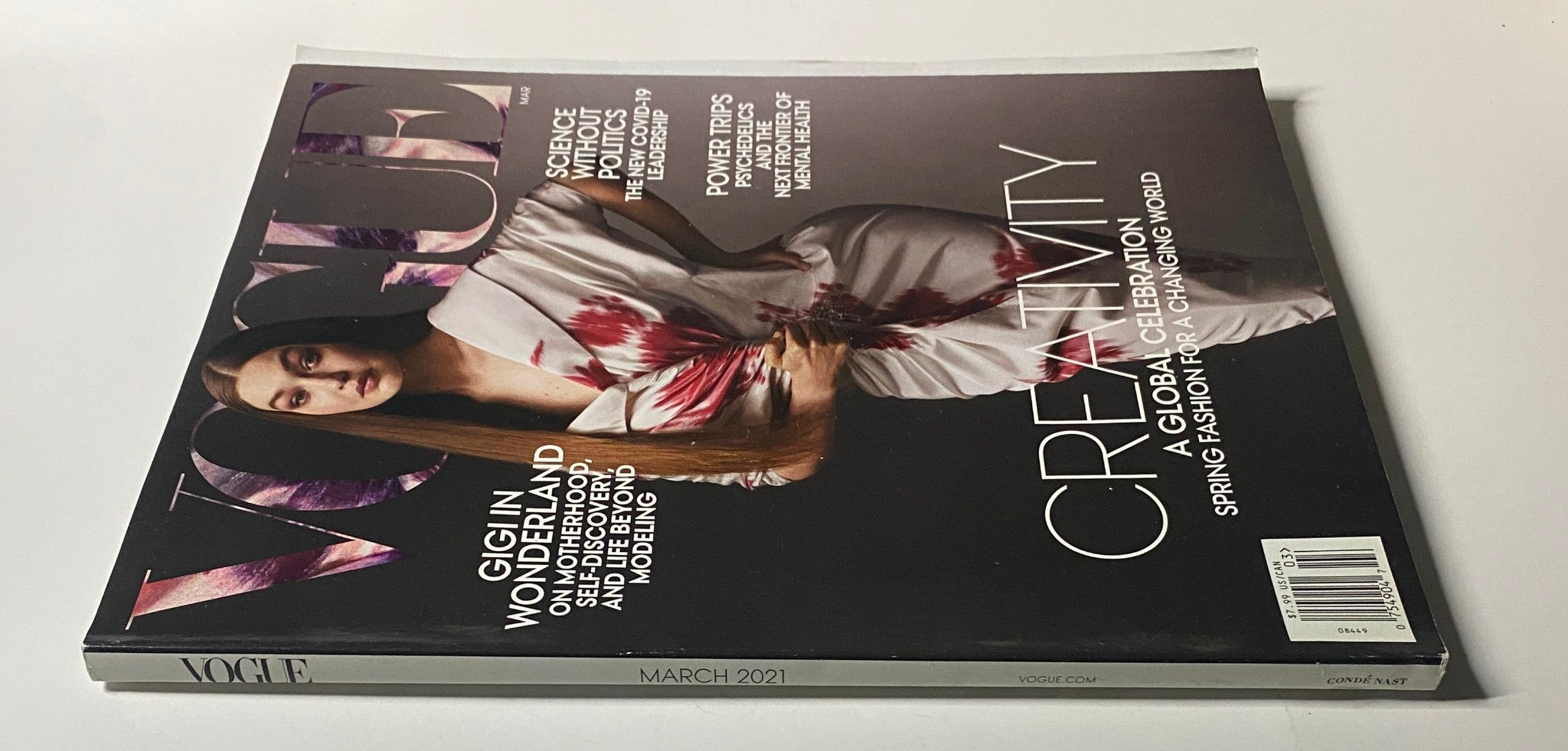Side view of Vogue Magazine March 2021, showcasing Gigi Hadid on the cover with the text 'Creativity' emphasizing the magazine's theme.