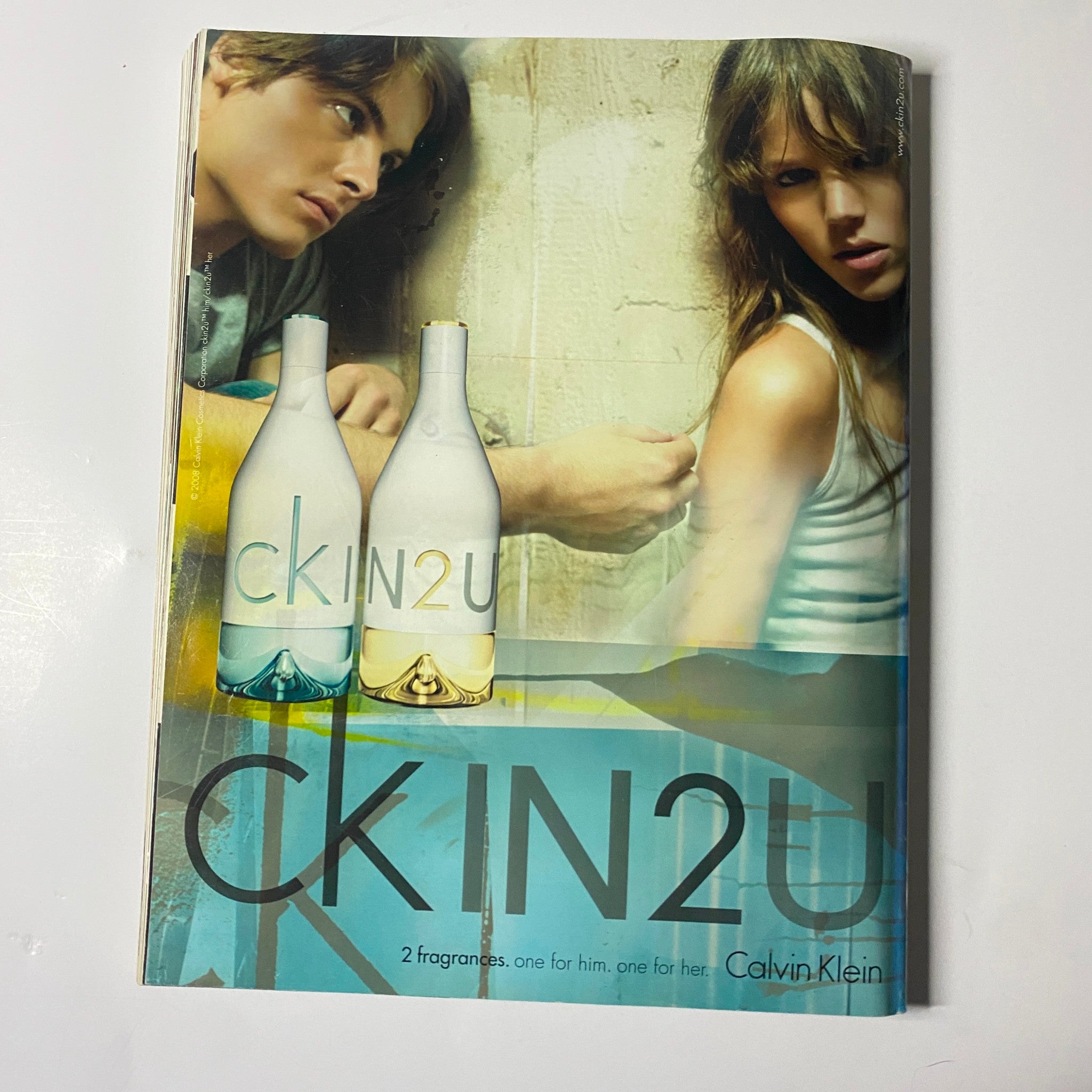 Elle UK Magazine April 2008 Kate Hudson Cover showcasing a Calvin Klein advertisement for CK IN2U fragrances with models presenting the scents.