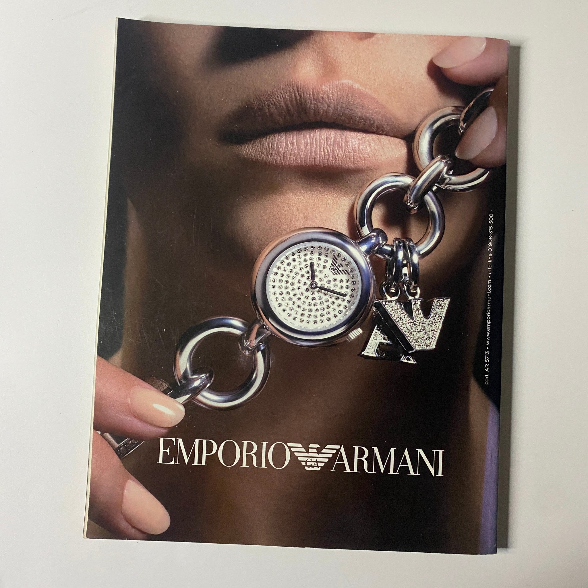 Emporio Armani advertisement in Elle UK Magazine May 2008, highlighting a luxury watch with a focus on elegant fashion accessories.