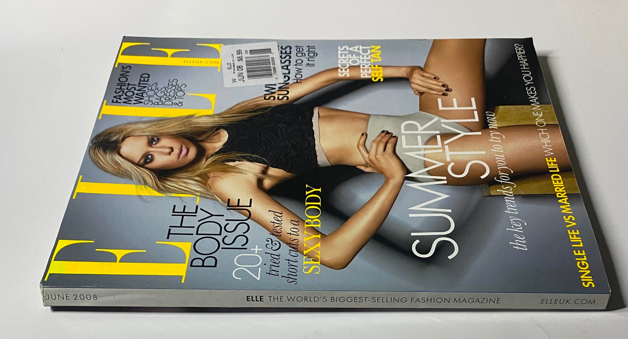 Elle UK Magazine June 2008 showcasing a model in a black top and skirt, emphasizing summer style and the body issue. Great for fashion collectors.