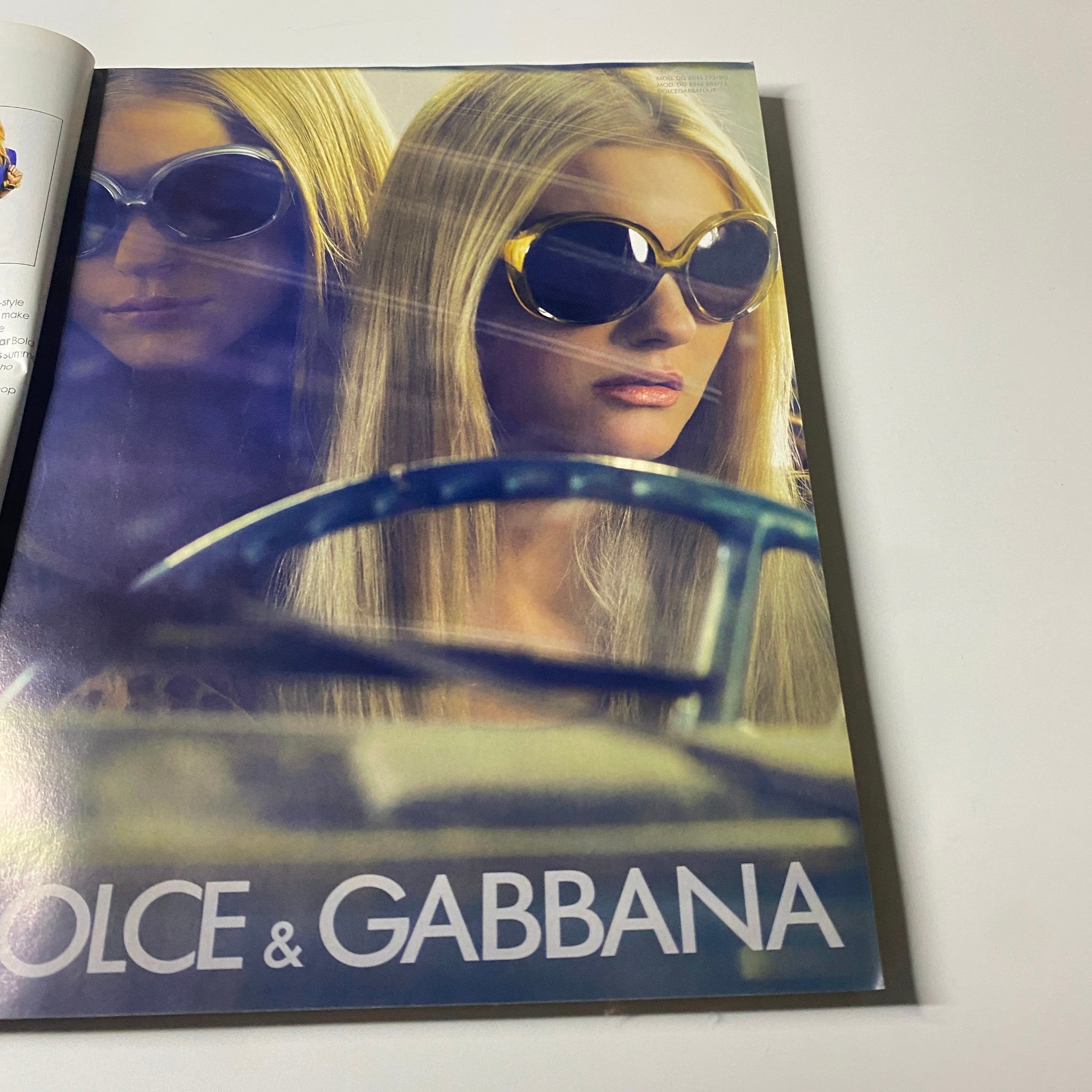 Dolce & Gabbana advertisement from Elle UK Magazine June 2008 featuring models wearing stylish sunglasses, promoting summer fashion.