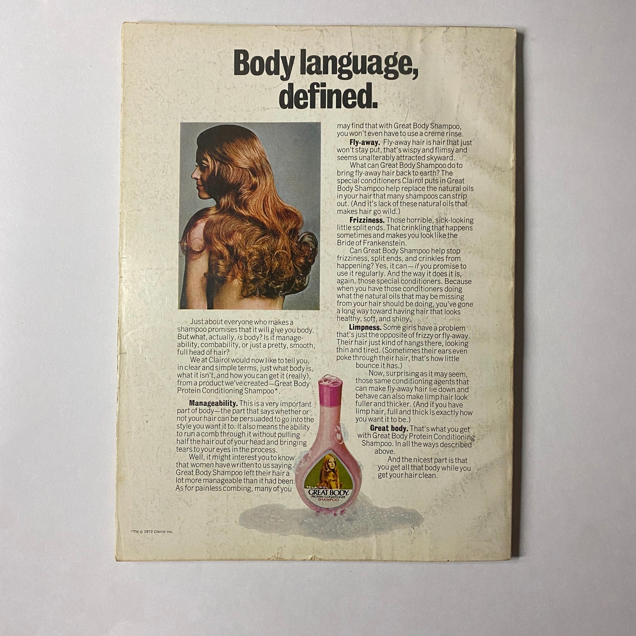 Back cover of the July 1972 Glamour Magazine featuring a model with long hair showcasing an ad for Body Shampoo, emphasizing beauty and hair care, in the context of the magazine's fashion and lifestyle themes.