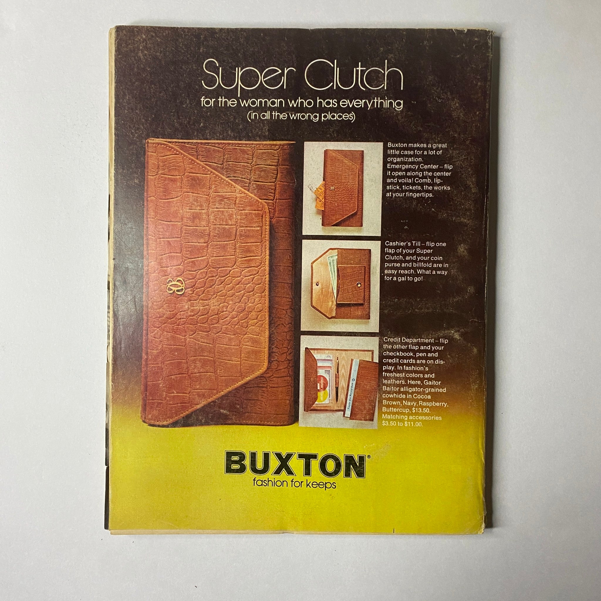 Glamour Magazine August 1972 cover showcasing the 'Super Clutch' advertisement for Buxton, targeting women and their fashion needs. This eye-catching ad promotes stylish organization for the modern woman.