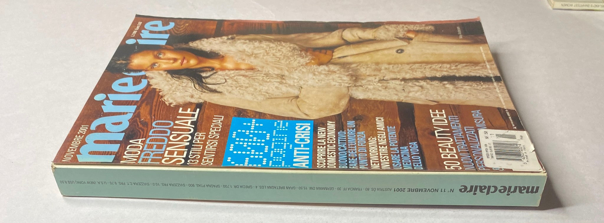 Side view of the November 2001 issue of Marie Claire Italia showcasing May Andersen on the cover, emphasizing stylish winter fashion.