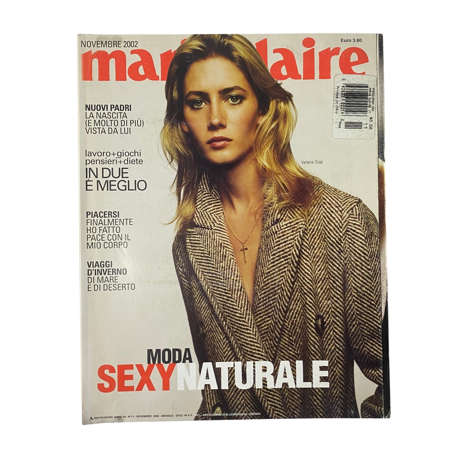 Cover of Marie Claire Italia Magazine, November 2002 featuring Valerie Sipp. The magazine highlights topics of retro-inspired fashion and thoughtful living, showcasing stylish attire and dynamic lifestyle stories.