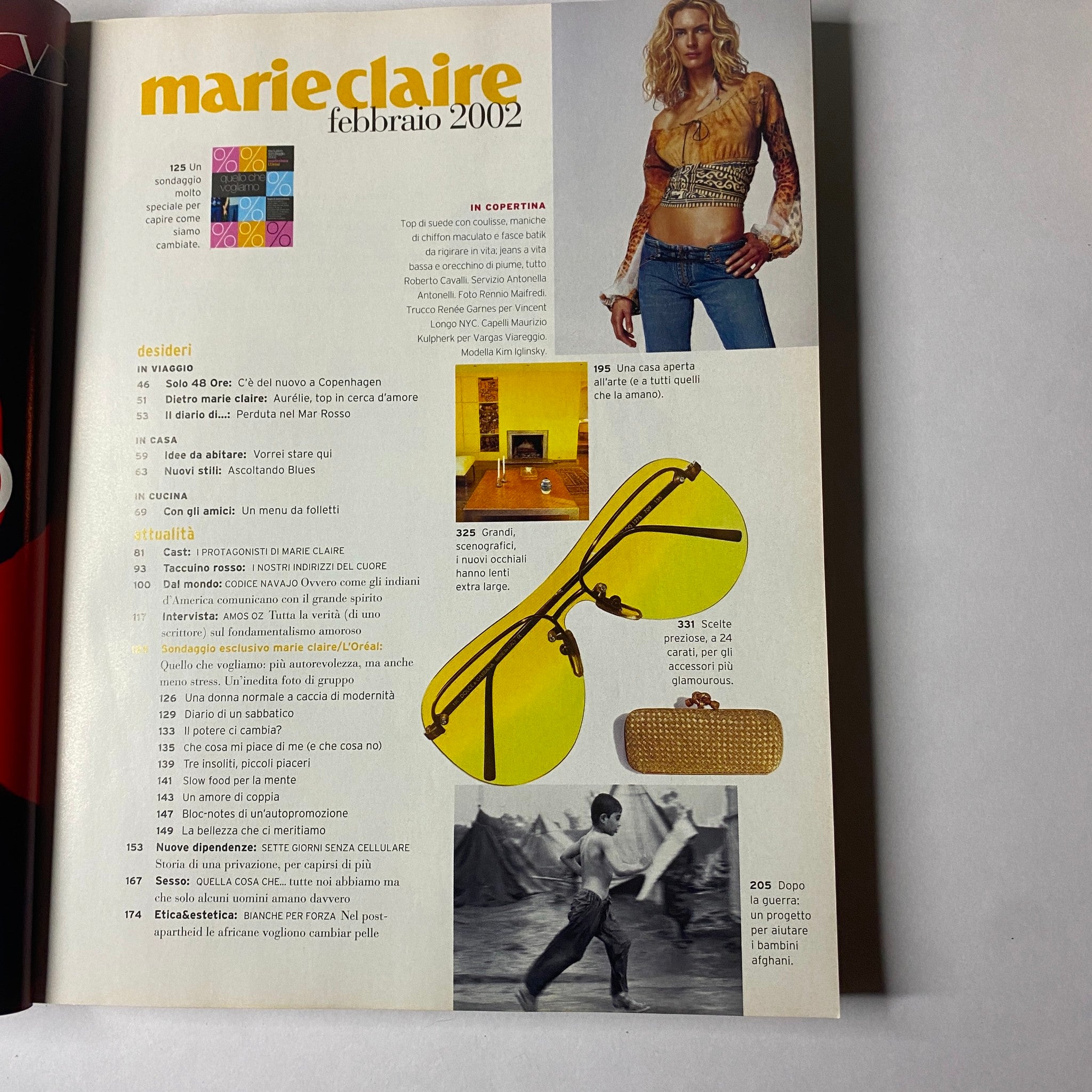 Table of contents page from Marie Claire Italia Magazine February 2002, summarizing featured articles, including travel inspirations and lifestyle sections. This edition emphasizes cultural narratives and style.