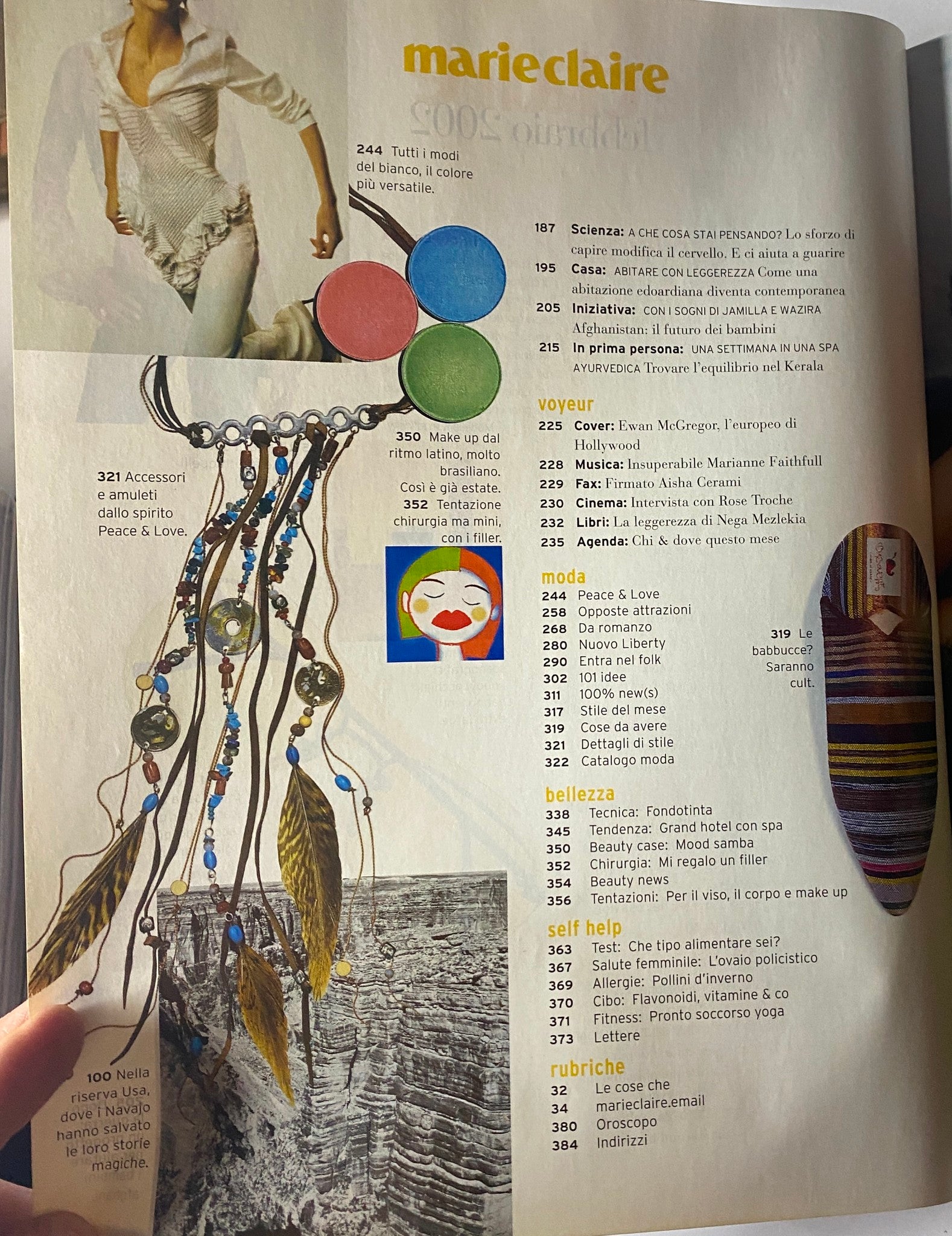 Content page from Marie Claire Italia February 2002 showcasing stylish accessories and beauty tips. Highlights include artistic elements, emphasizing peace and love themes.