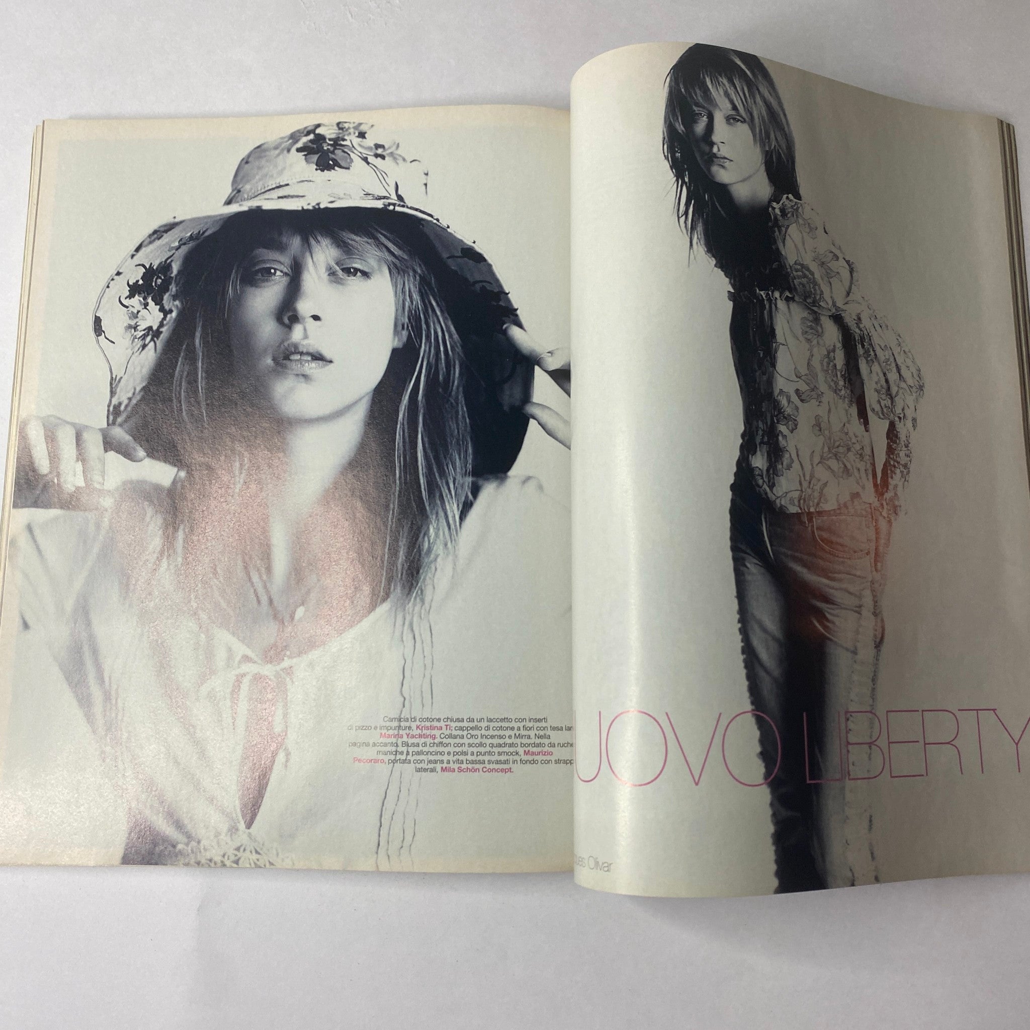 Marie Claire Italia February 2002 magazine spread featuring model Kim Iglinsky showcasing a stylish look in a floral hat and chic outfit, emphasizing contemporary fashion and lifestyle.
