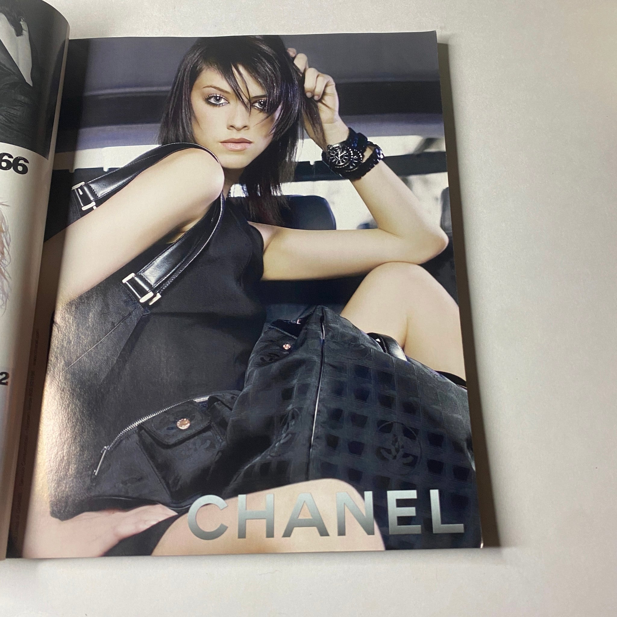 Fashion advertisement in Marie Claire Italia January 2003 showcasing a model styled in Chanel attire with a striking pose.