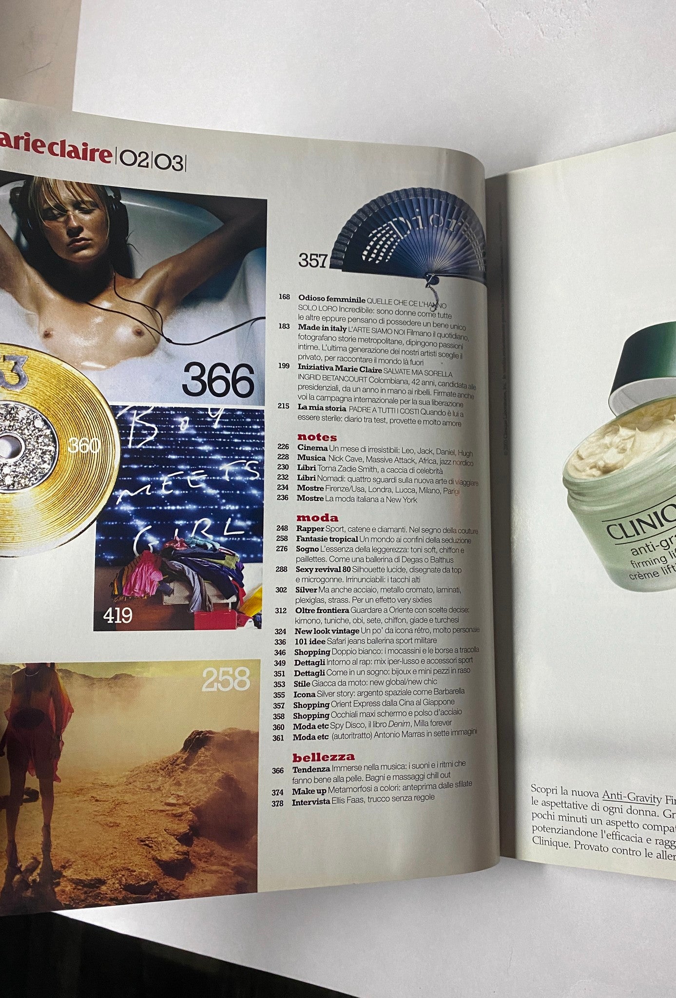 Marie Claire Italia Magazine February 2003 page featuring content related to gender topics and fashion, marked by a dynamic layout and visuals, showcasing the cover model Delfine Bafort.