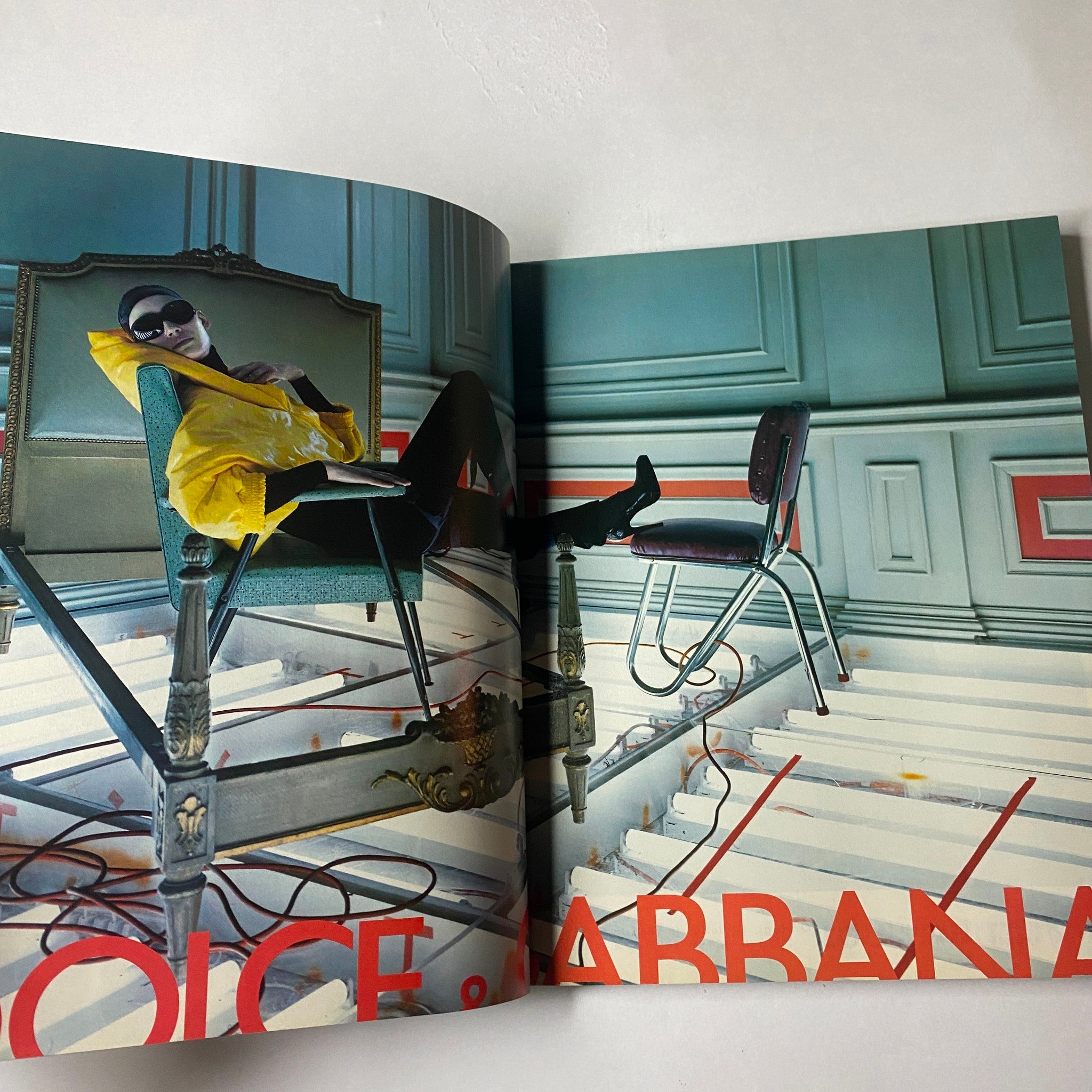 Inside page of Marie Claire Italia Magazine August 2003 featuring a striking fashion editorial with a model in avant-garde styling against a bold, colorful background. Cover model Tetyana Brazhnyk adds to the dynamic fashion narrative.