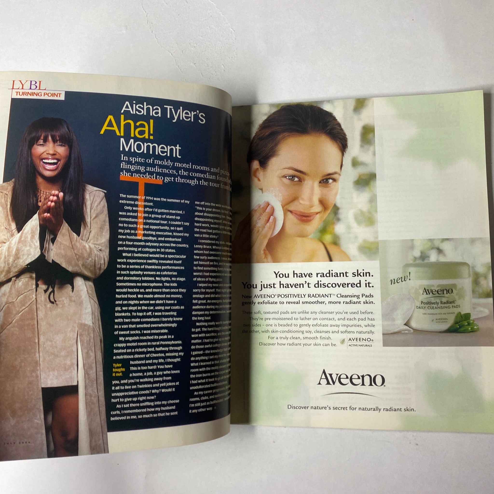 A spread from The Oprah Magazine July 2004 showcasing Aisha Tyler's article on skin radiance, promoting Aveeno's skincare products.