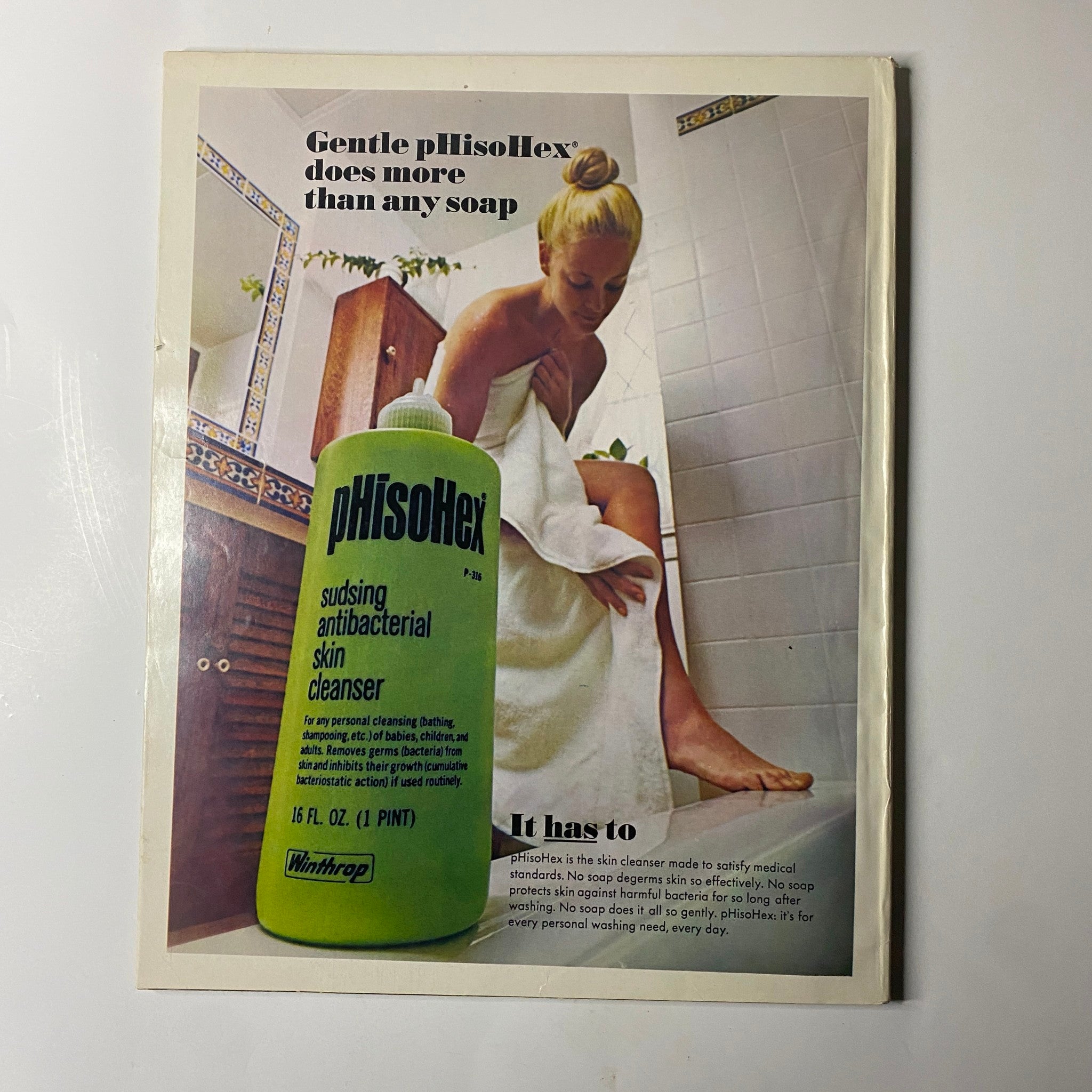 Advertisement in Seventeen Magazine September 1971 for pHisoHex, an antibacterial skin cleanser, depicting a woman in a bathroom setting.
