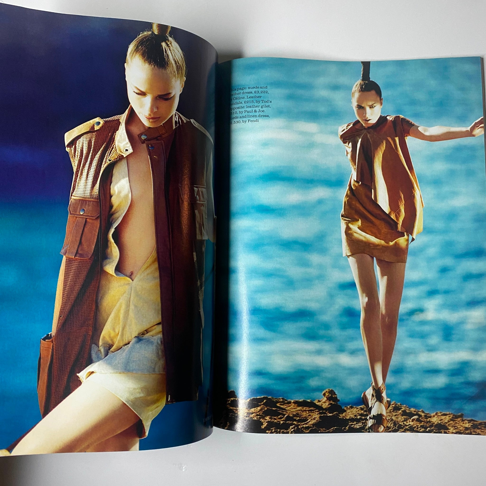 Fashion editorial spread from Elle UK Magazine May 2010 featuring a model in stylish attire against a scenic seaside backdrop.