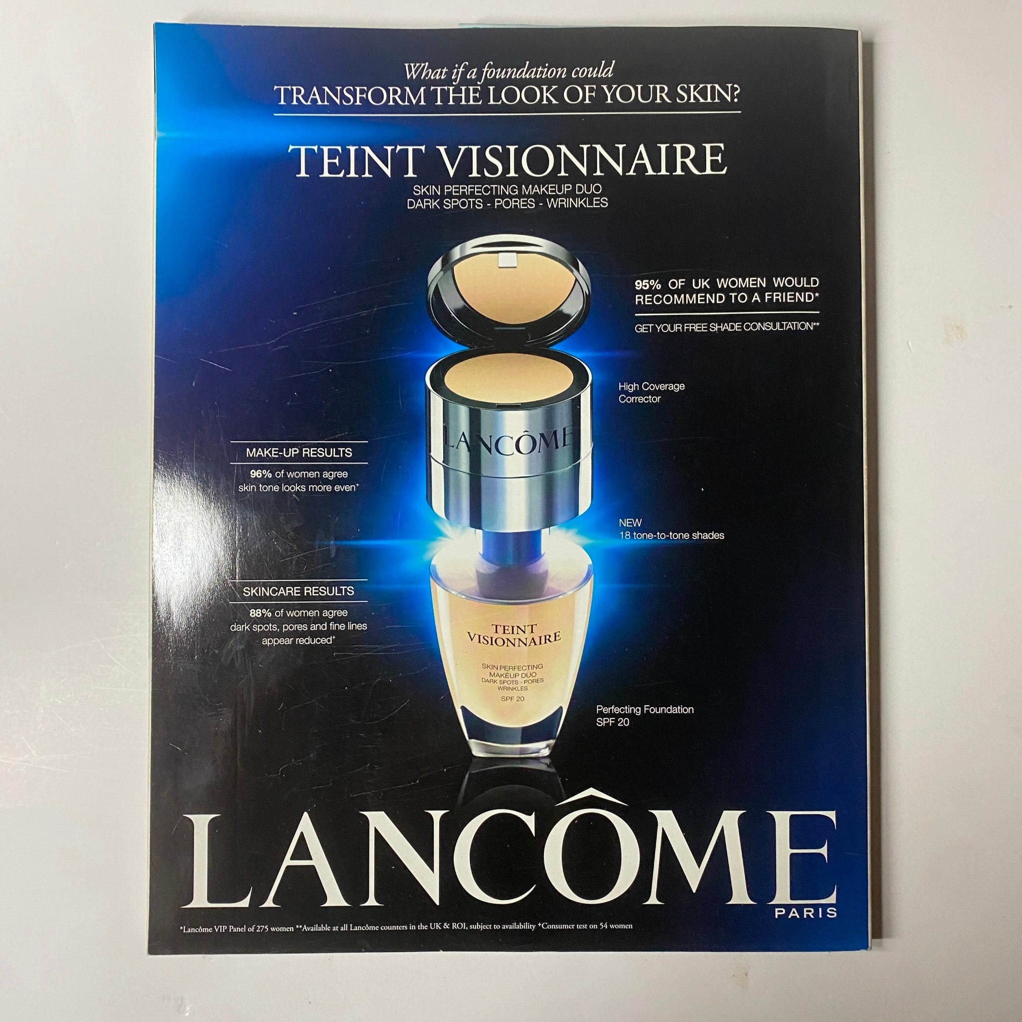 Elle UK Magazine June 2013, featuring a promotional advertisement for Lancôme's skin perfecting foundation, highlighting high coverage and skincare benefits.