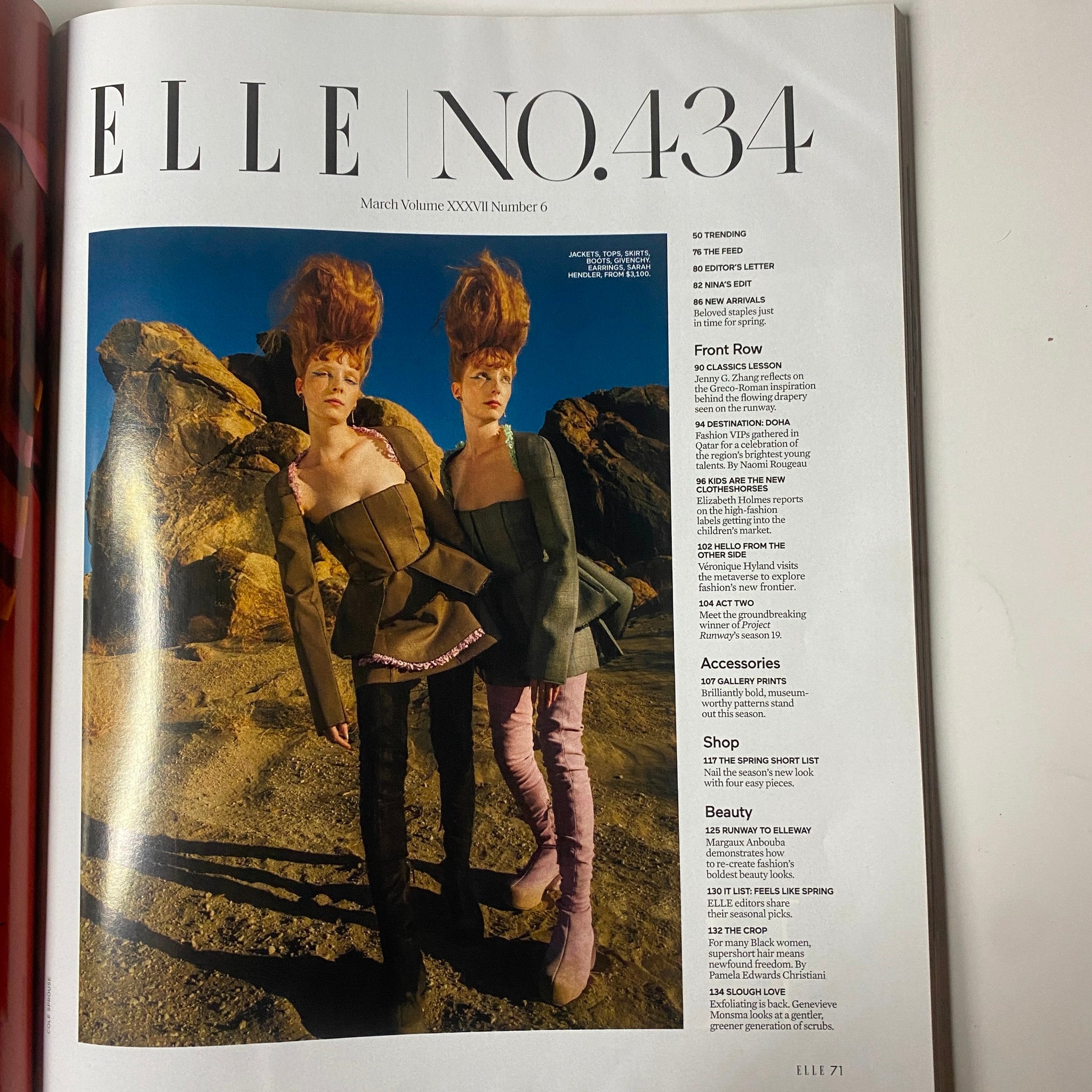Interior page from Elle Magazine March 2022, showcasing editorial content including fashion trends, featuring a unique fashion editorial with two models in striking outfits.