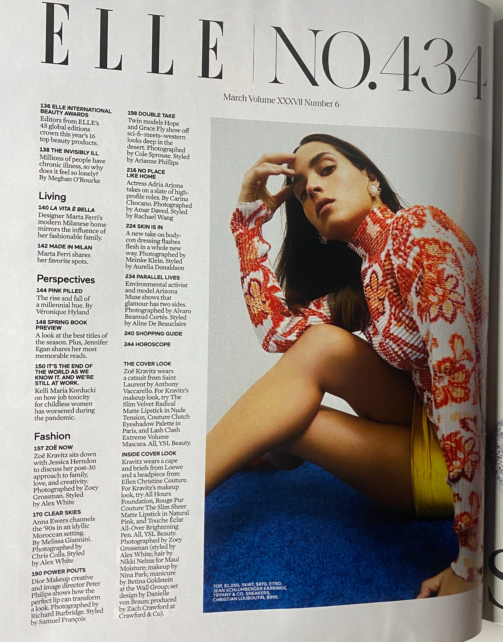 Elle Magazine March 2022 Zoë Kravitz Cover featuring a bold fashion statement with Zoë Kravitz in a colorful outfit, stylishly designed with contemporary aesthetics.