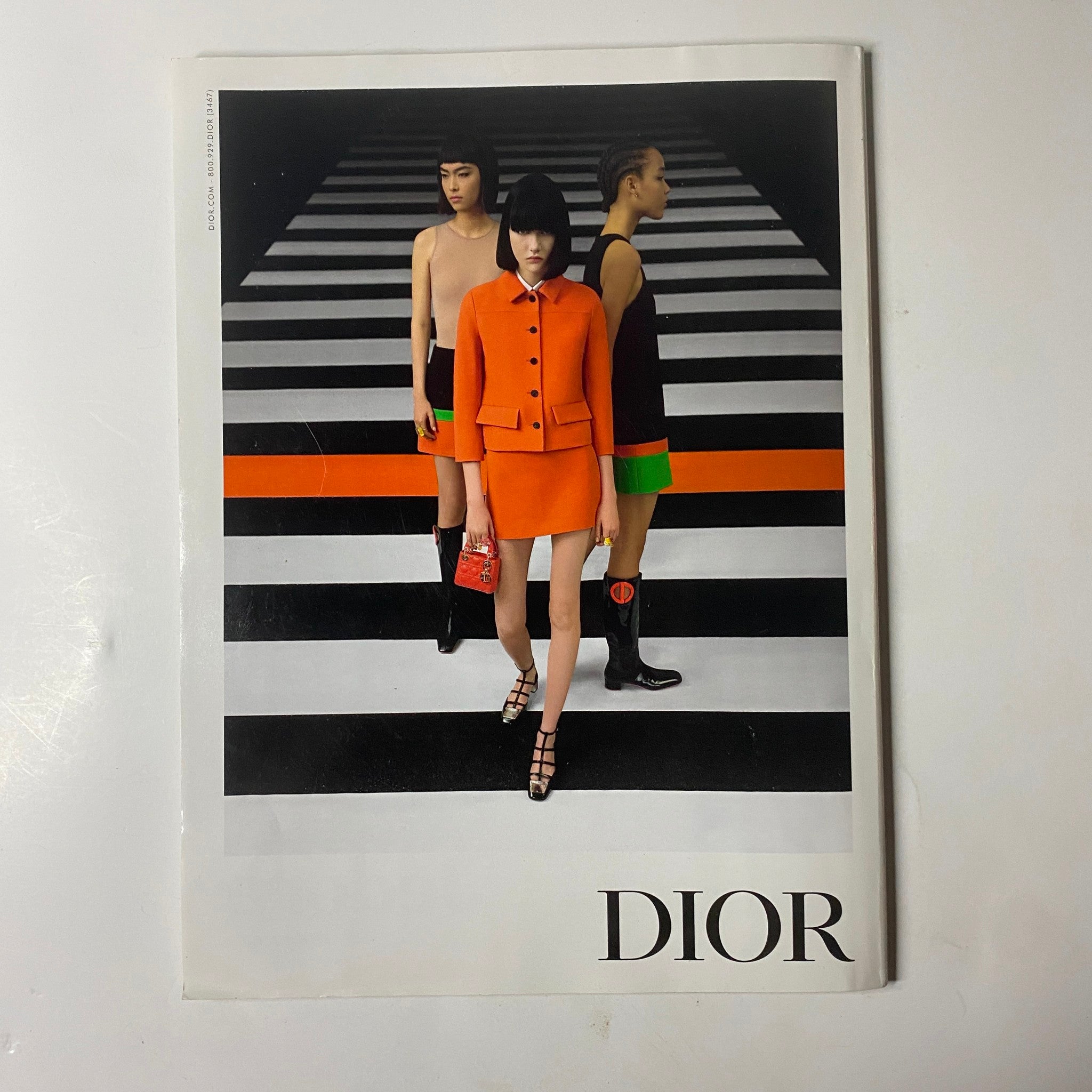 Dior magazine cover featuring models in vibrant outfits on a striped background, showcasing contemporary fashion. Elle Magazine – February 2022 – Mary J. Blige Cover (No Mailing Label, Very Good Condition) highlights iconic styles.