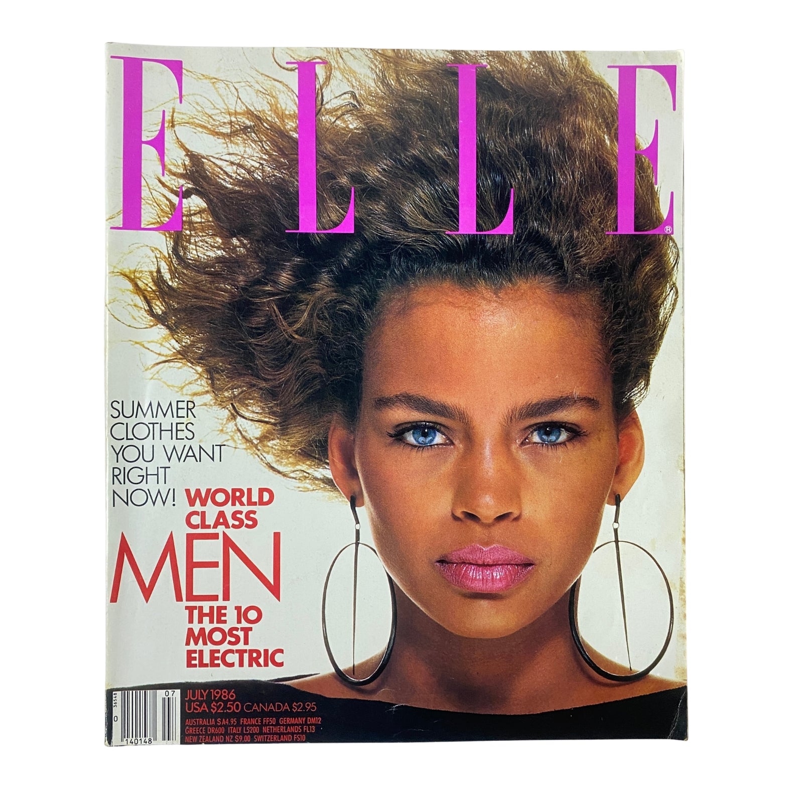 Elle Magazine July 1986 No. 11 cover featuring model with bold hairstyle and earrings, highlighting the theme 'World Class Men: The 10 Most Electric'. Very good condition, no label.