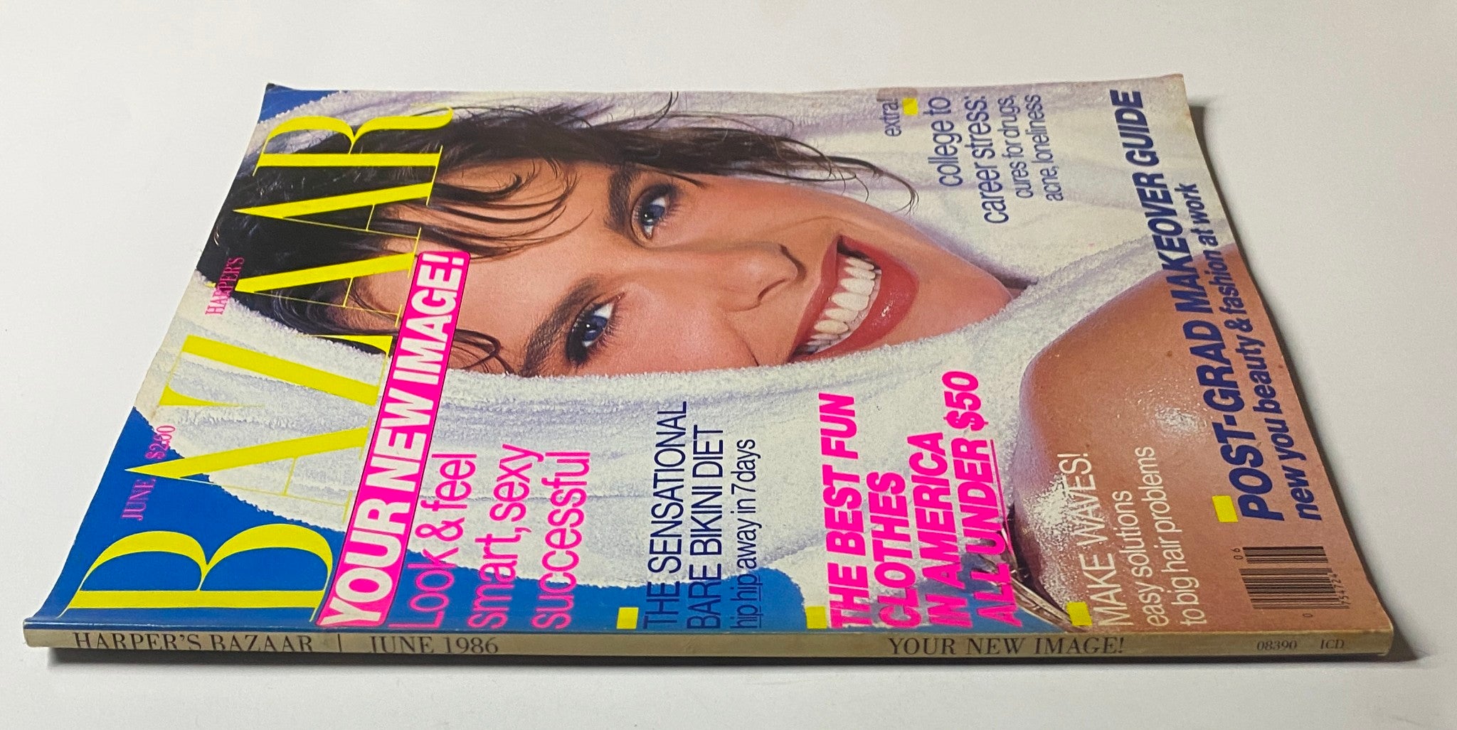 Harper's Bazaar Magazine June 1986 with Kirsten Allen on the cover, displaying a chic layout with advertisements for hair solutions, fashion deals, and a post-graduate makeover guide.