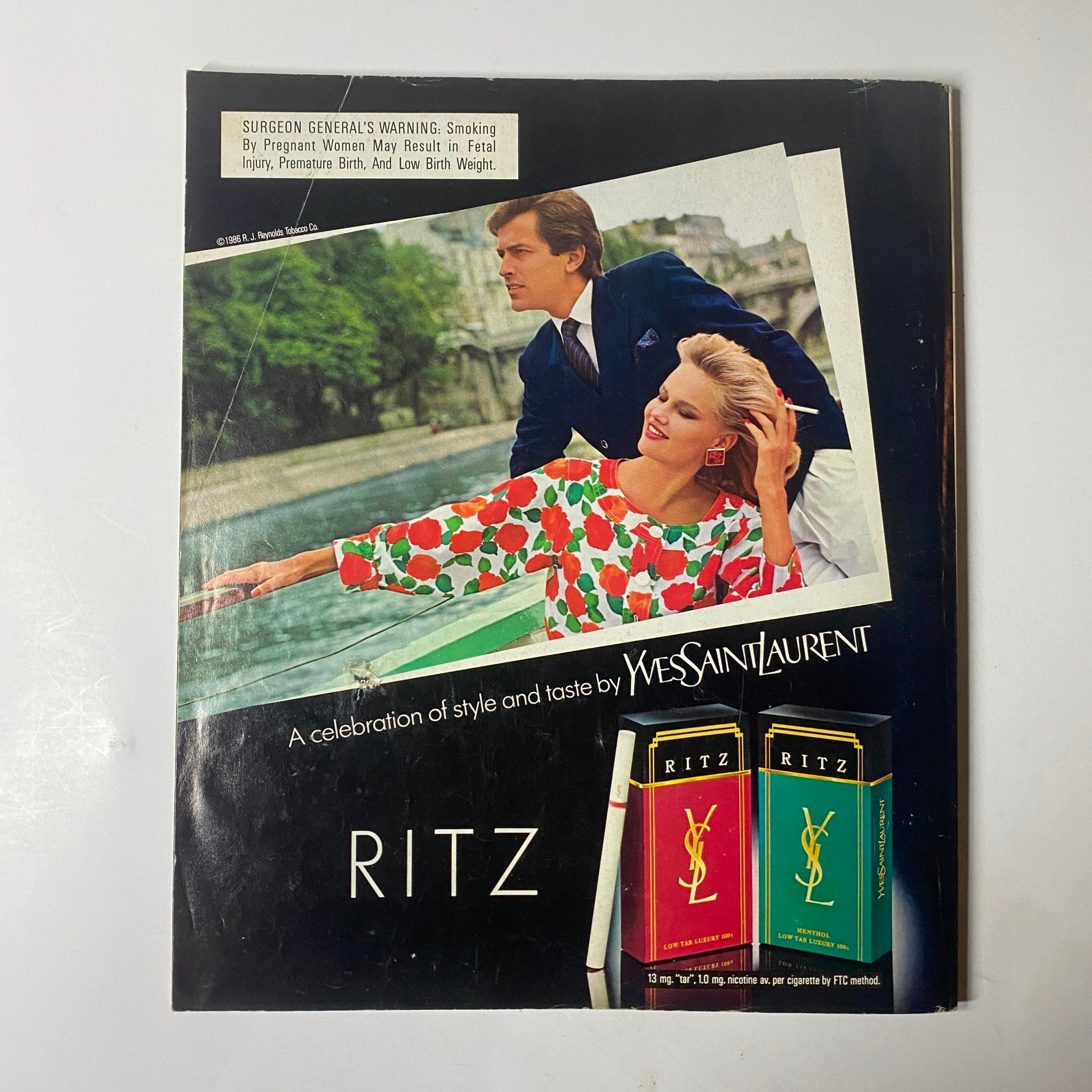 Cover of Harper's Bazaar Magazine June 1986 featuring Kirsten Allen. The image showcases a fashionable scene with a model in a stylish outfit, adorned with vibrant colors, alongside a man in formal attire. This No Label edition highlights a moment in 1980s fashion history, suitable for collectors and enthusiasts.