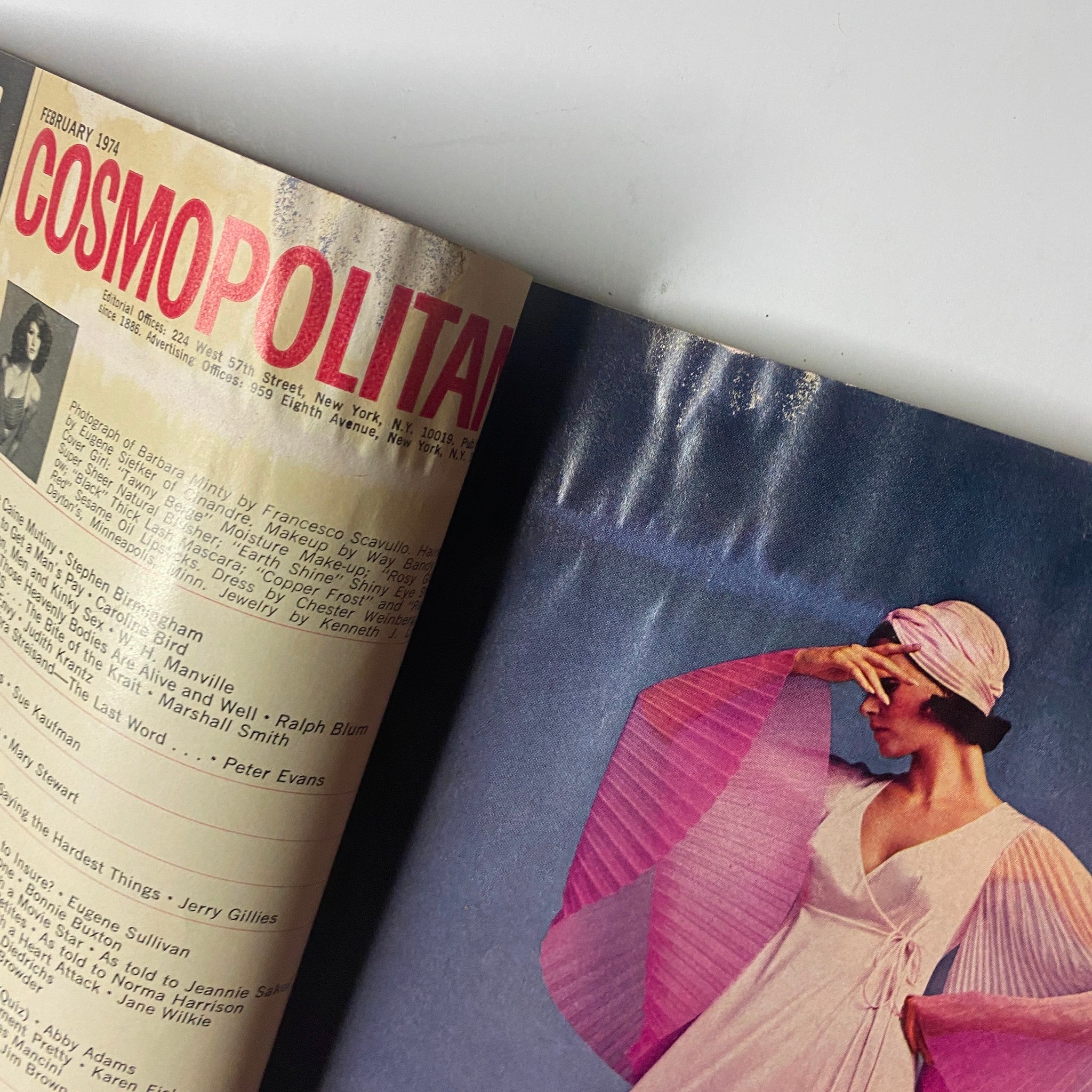 Interior page of Cosmopolitan Magazine February 1974 showcasing content with a model wearing a stylish outfit, reflecting 1970s fashion.