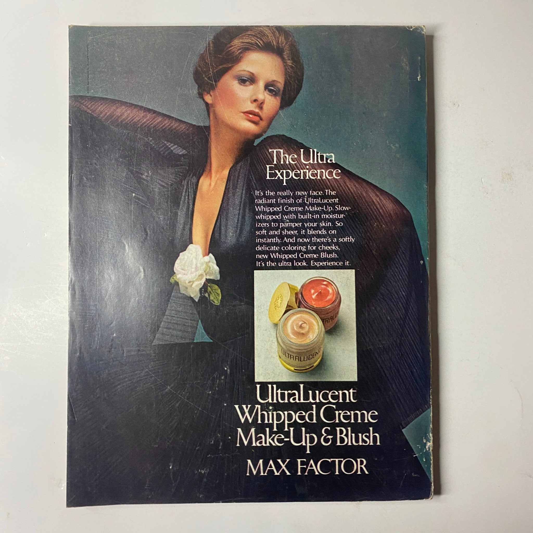 Back cover of Cosmopolitan Magazine February 1974 featuring an advertisement for Max Factor's UltraLucent Whipped Creme Make-Up & Blush, showcasing beauty products from the era.