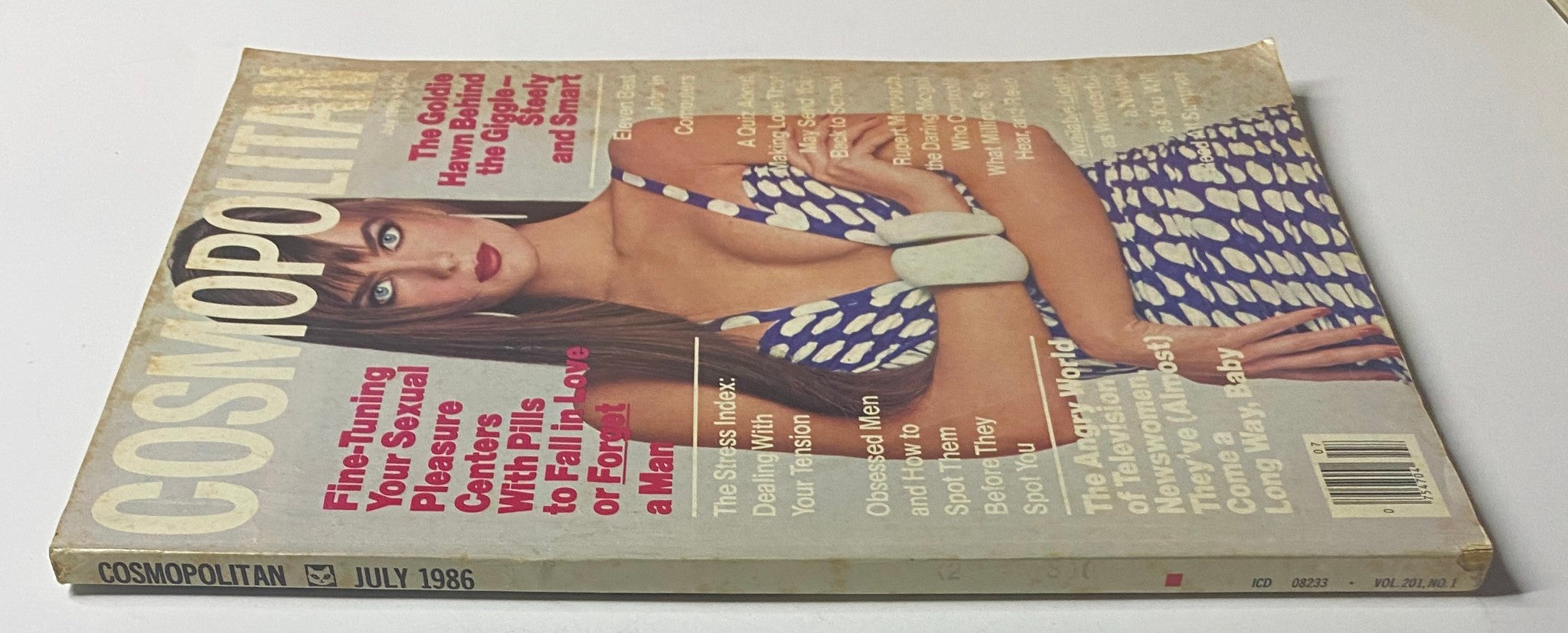 Side view of the July 1986 Cosmopolitan Magazine with Paulina Porizkova on the cover, displaying vintage magazine wear and graphics.