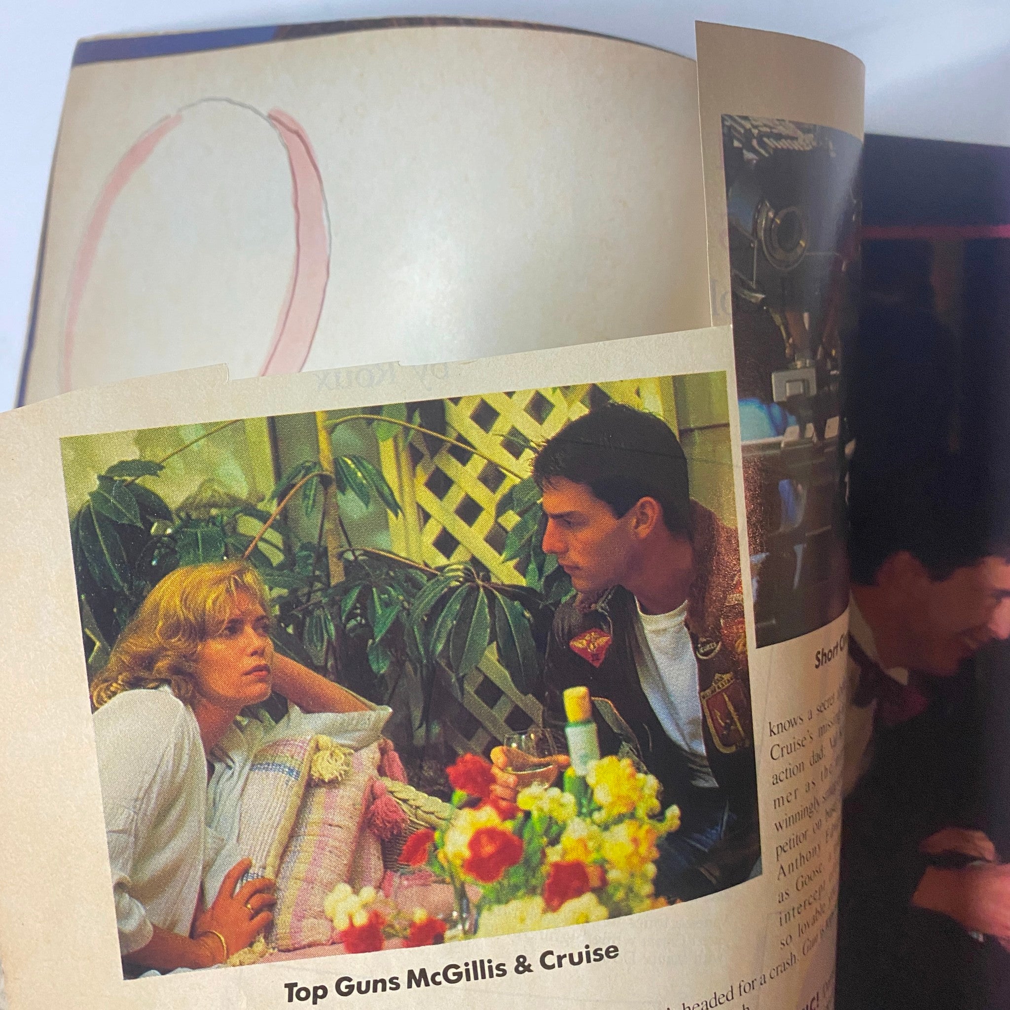 Interior page from the July 1986 Cosmopolitan Magazine depicting a scene from the movie Top Gun with characters McGillis and Cruise.