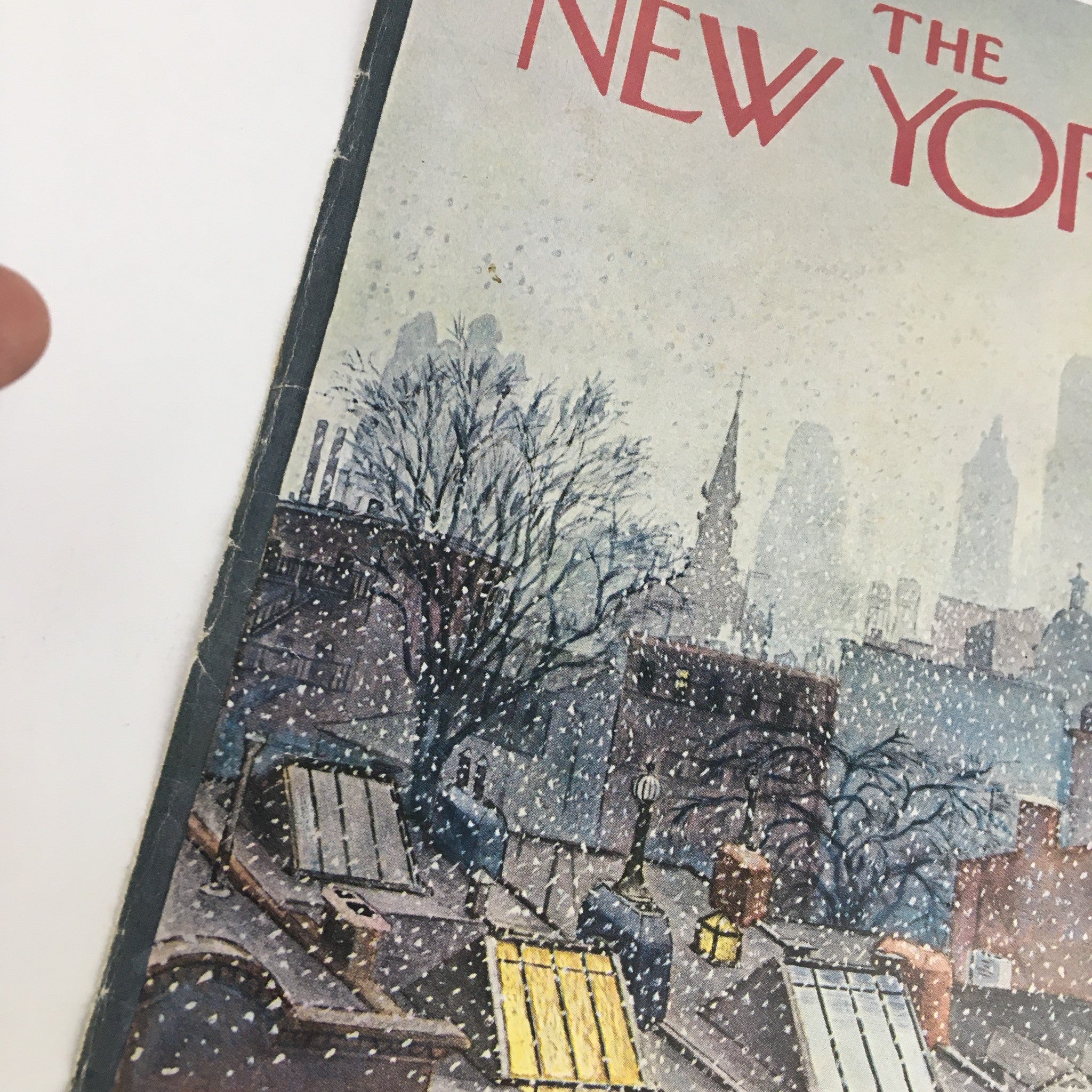 Close-up view of The New Yorker March 2 1968 cover, highlighting the title and snow-covered rooftops as part of the vintage illustration by Albert Hubbell.