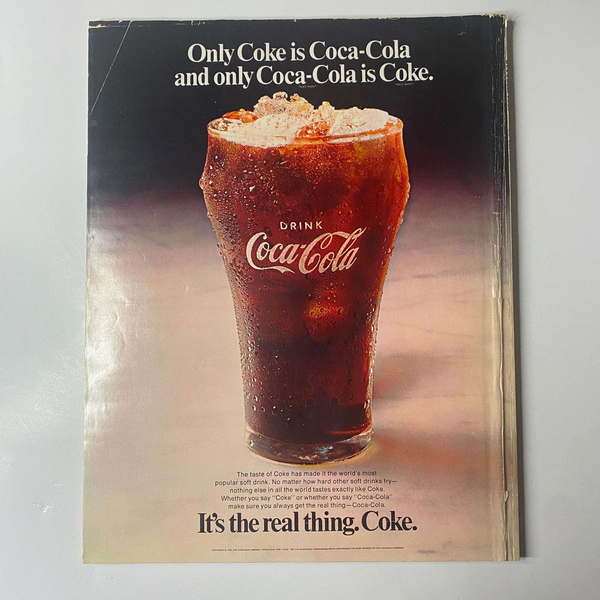 Seventeen Magazine October 1969 Special Shape Up Issue - A vintage advertisement for Coca-Cola, showcasing a glass filled with ice and soda. The ad states, 'It's the real thing. Coke.' highlighting the classic beverage.