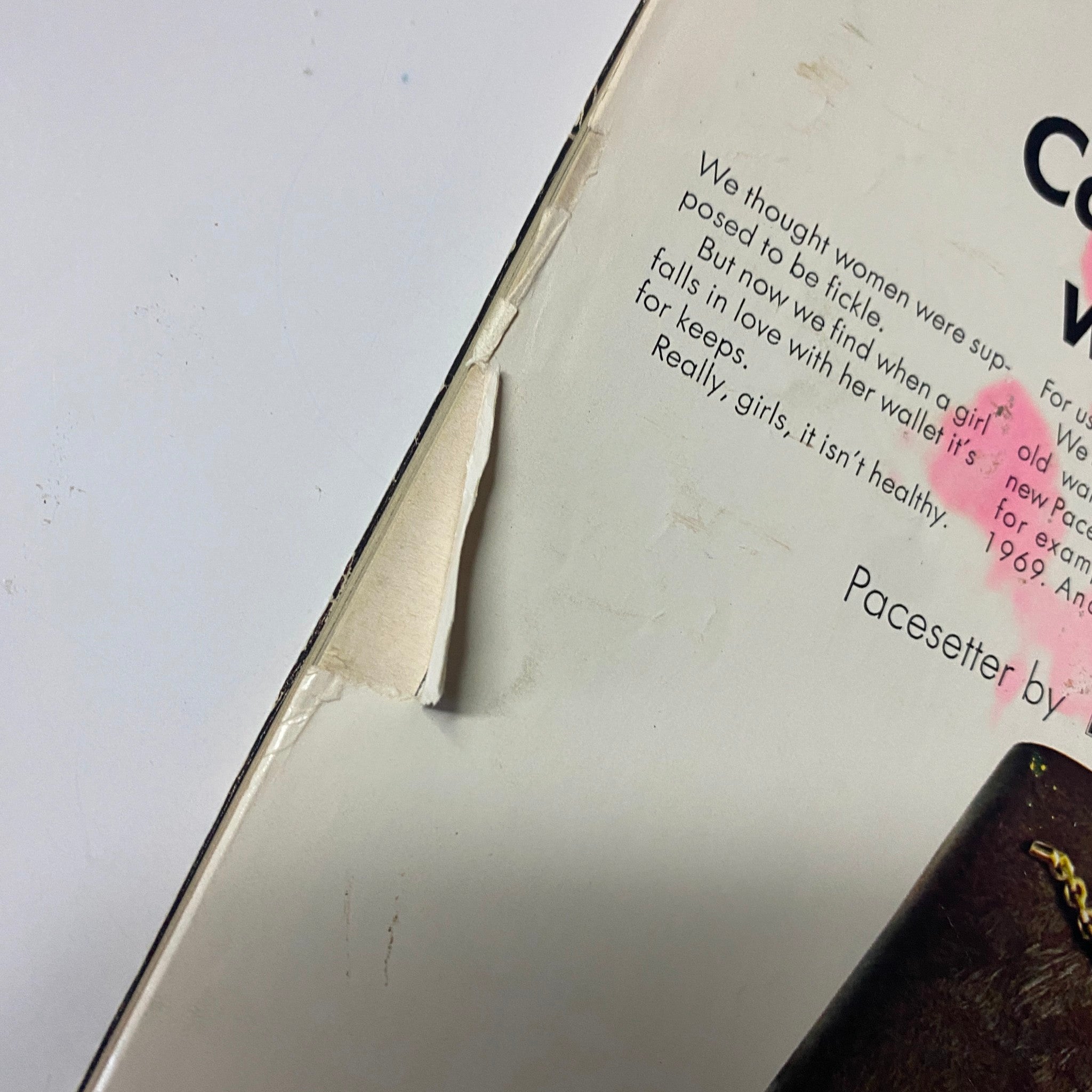 Close-up image of the edge of the back cover of Seventeen Magazine December 1969, showing a slight tear on the page alongside the Lady Buxton wallet advertisement.