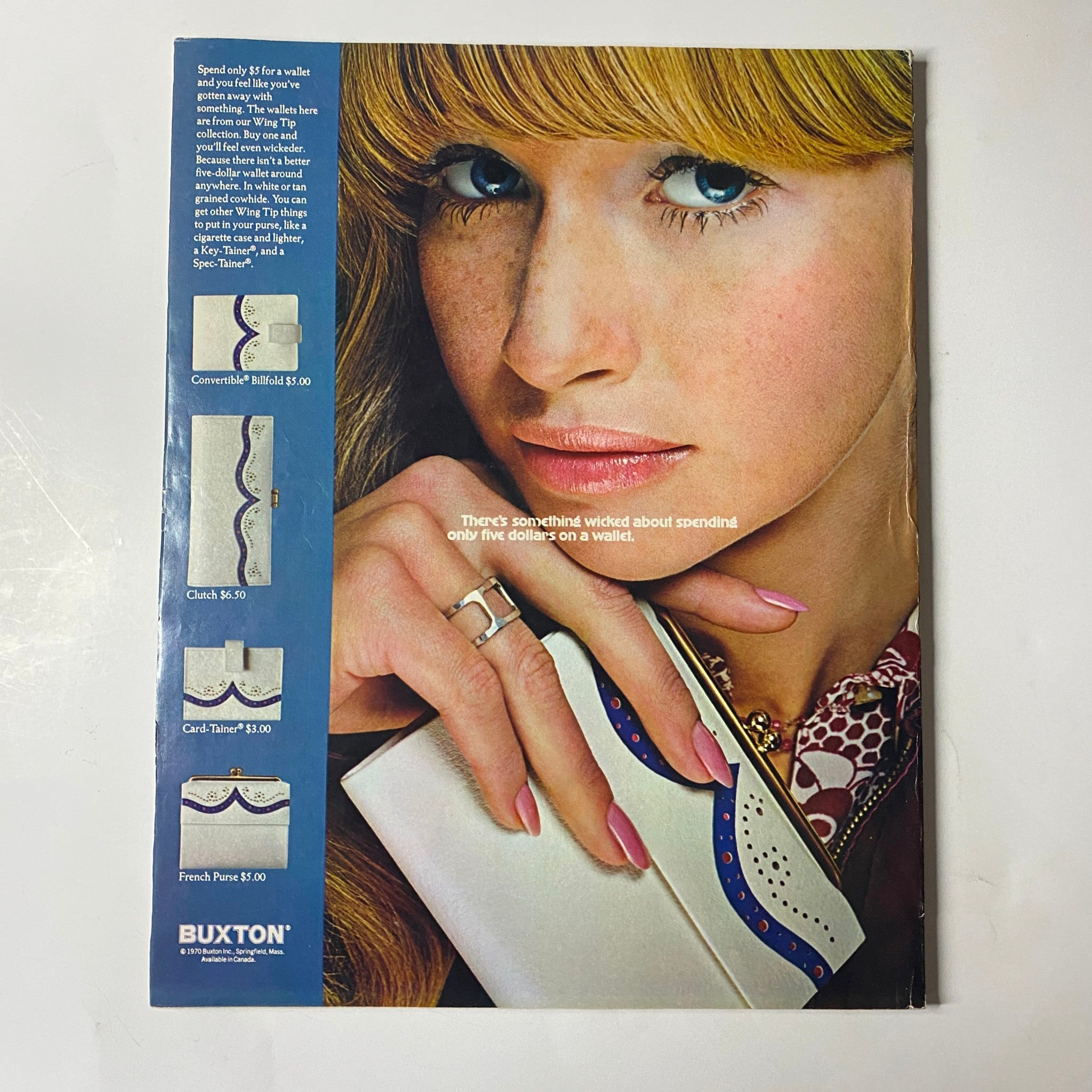 Back cover advertisement from Seventeen Magazine May 1970, featuring a model showcasing a stylish clutch bag from Buxton, emphasizing fashion accessories that complement youthful attire.
